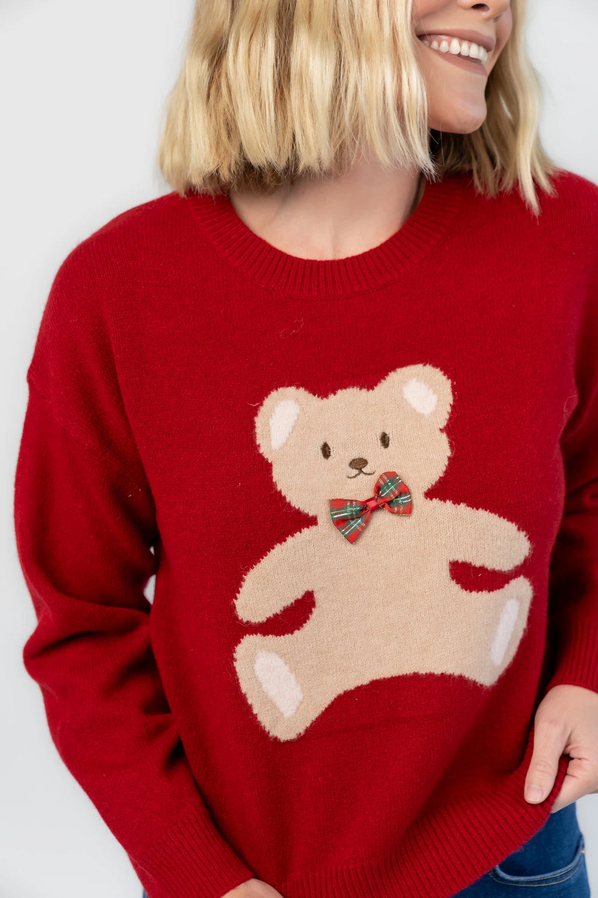 Jaxton Sweater in Red with a round neckline, ribbed trim, and a teddy bear graphic with a bow tie.