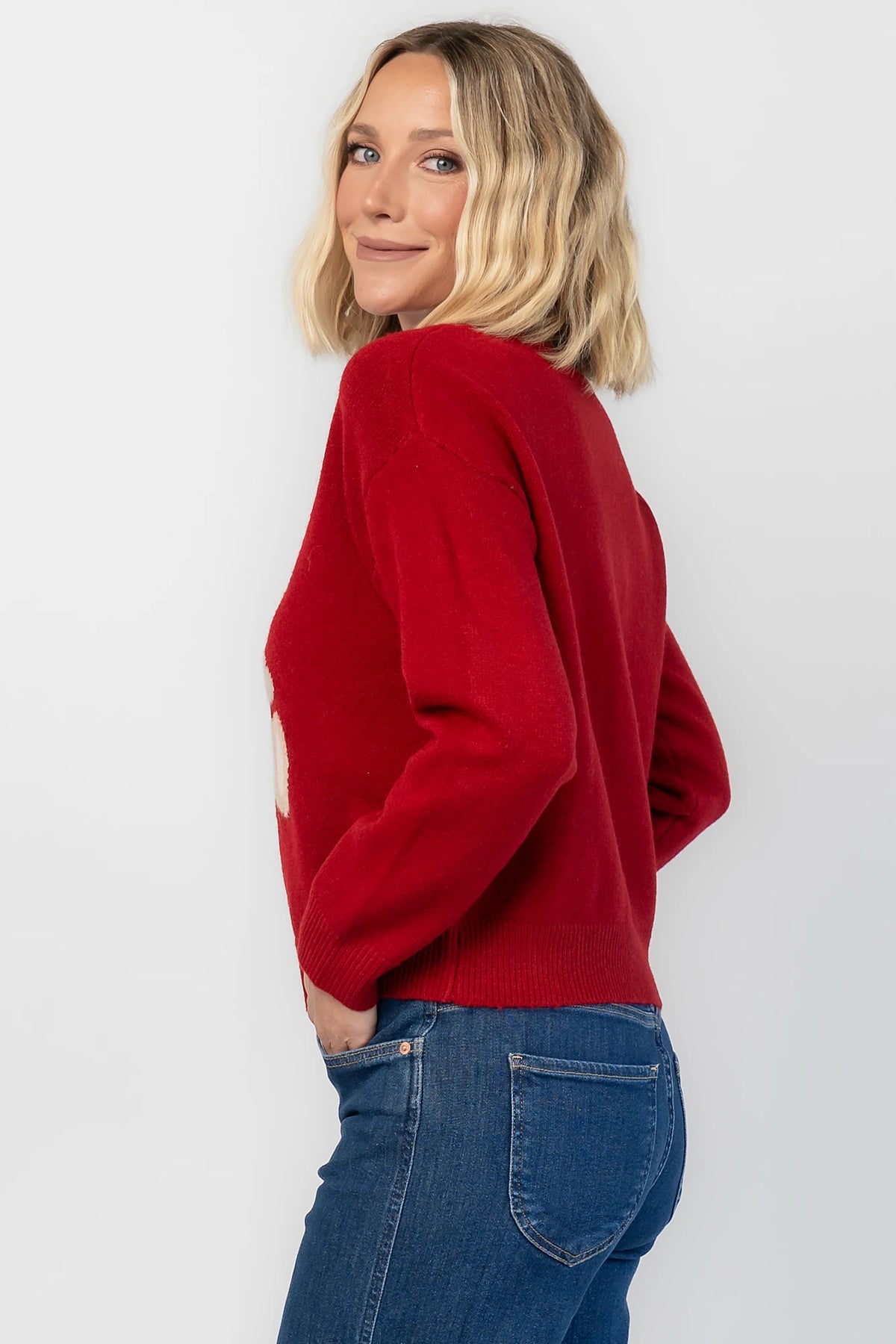 Jaxton Sweater in Red with a round neckline, ribbed trim, and a teddy bear graphic with a bow tie.