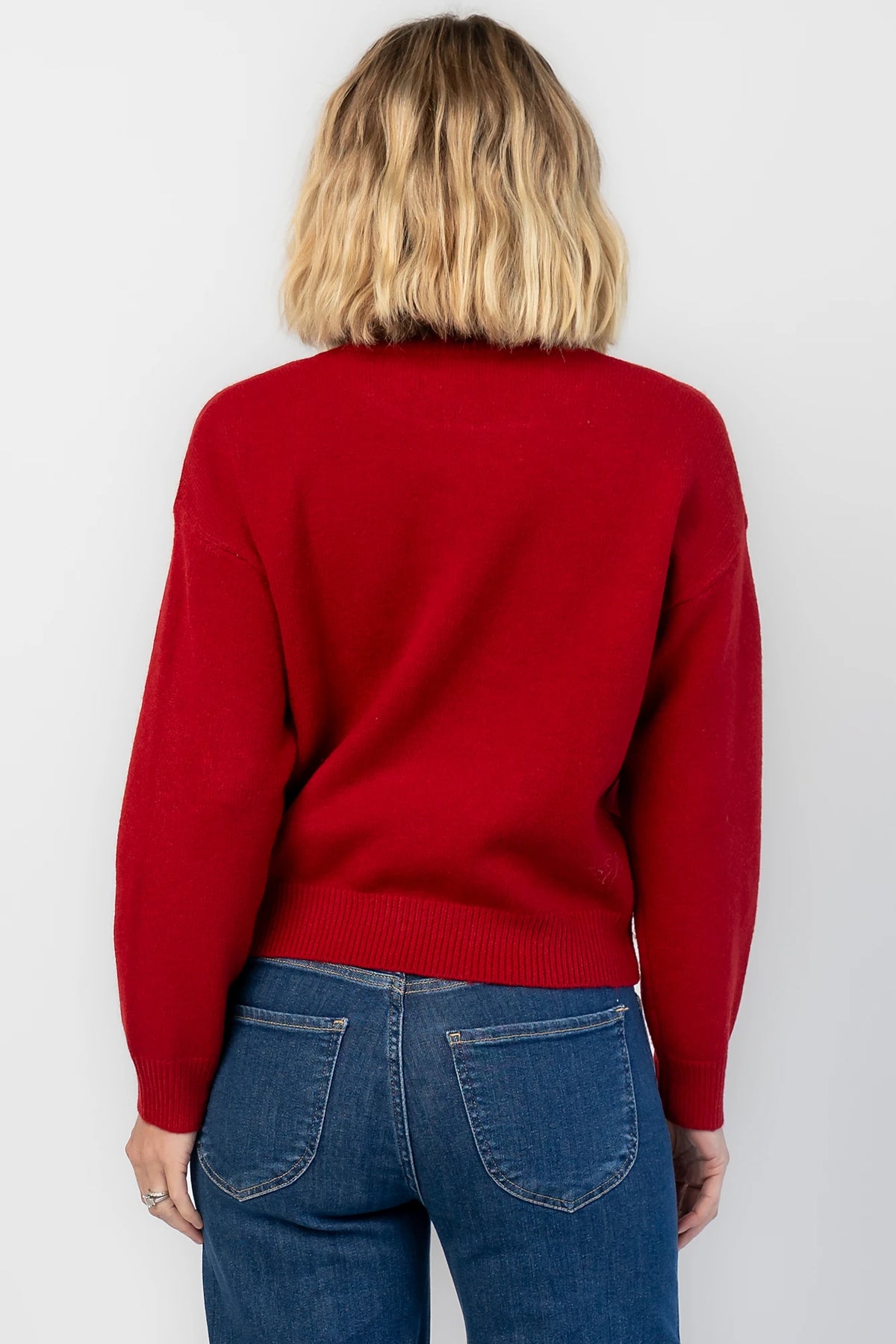 Jaxton Sweater in Red with a round neckline, ribbed trim, and a teddy bear graphic with a bow tie.