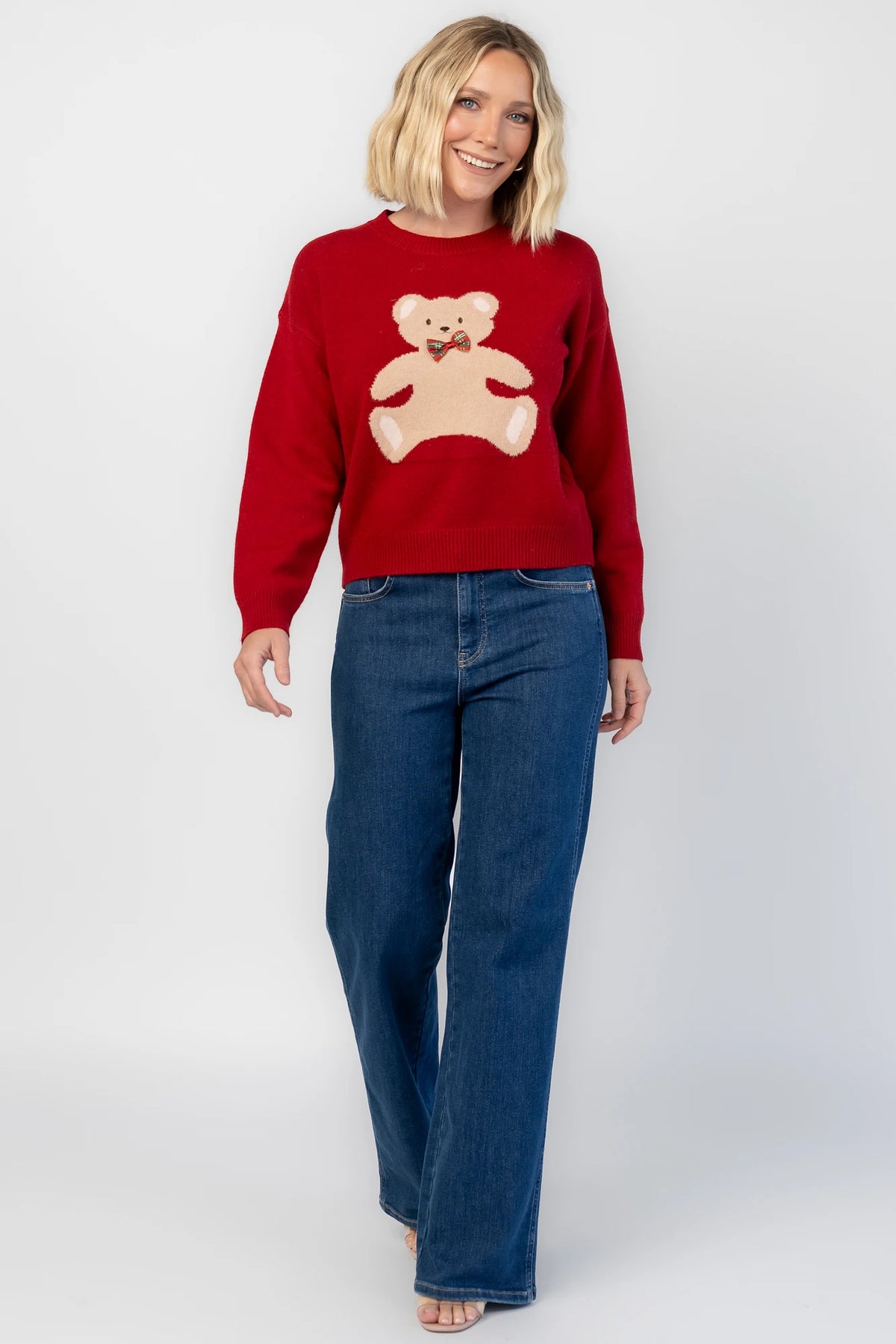 Jaxton Sweater in Red with a round neckline, ribbed trim, and a teddy bear graphic with a bow tie.