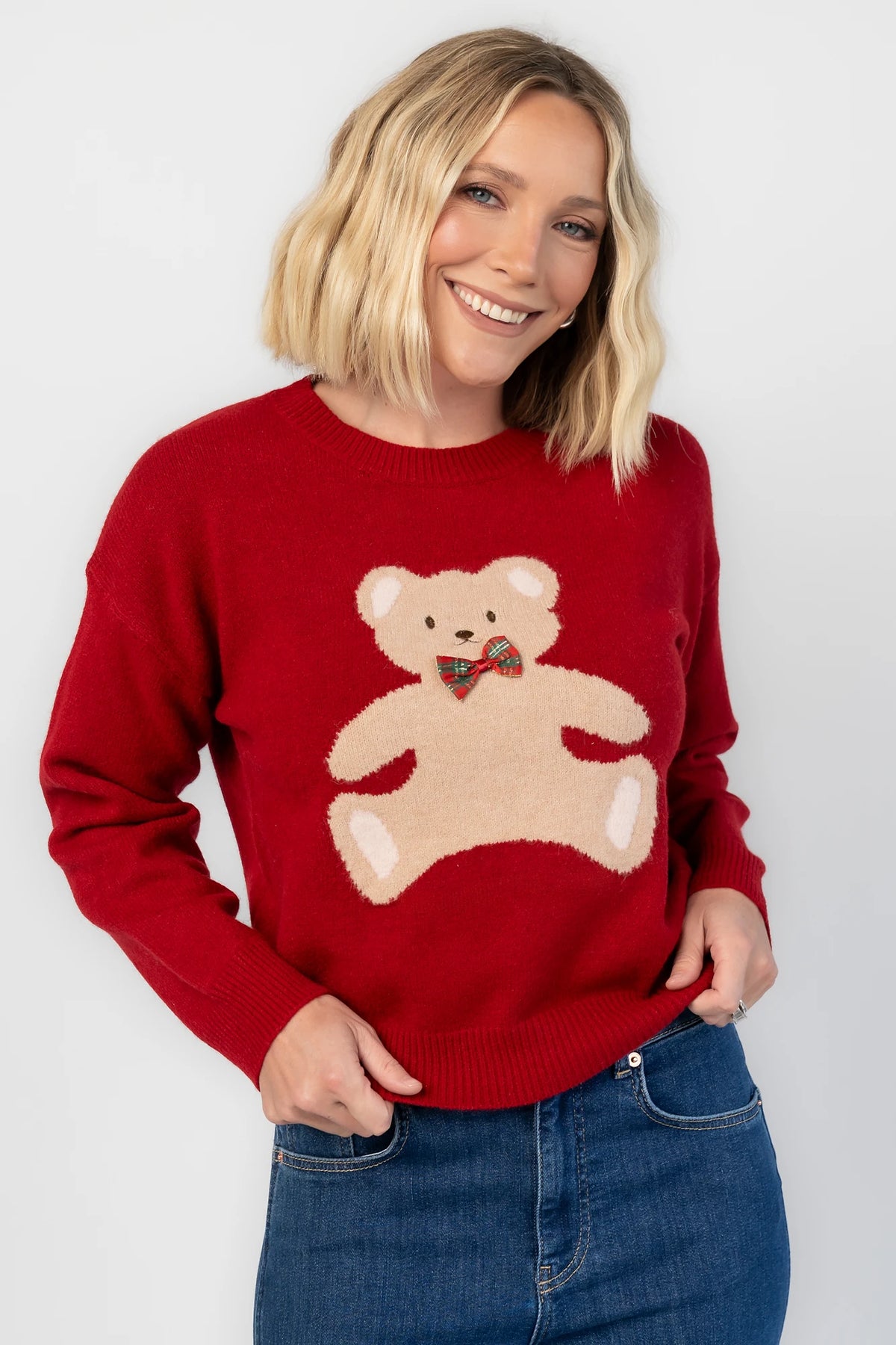 Jaxton Sweater in Red with a round neckline, ribbed trim, and a teddy bear graphic with a bow tie.
