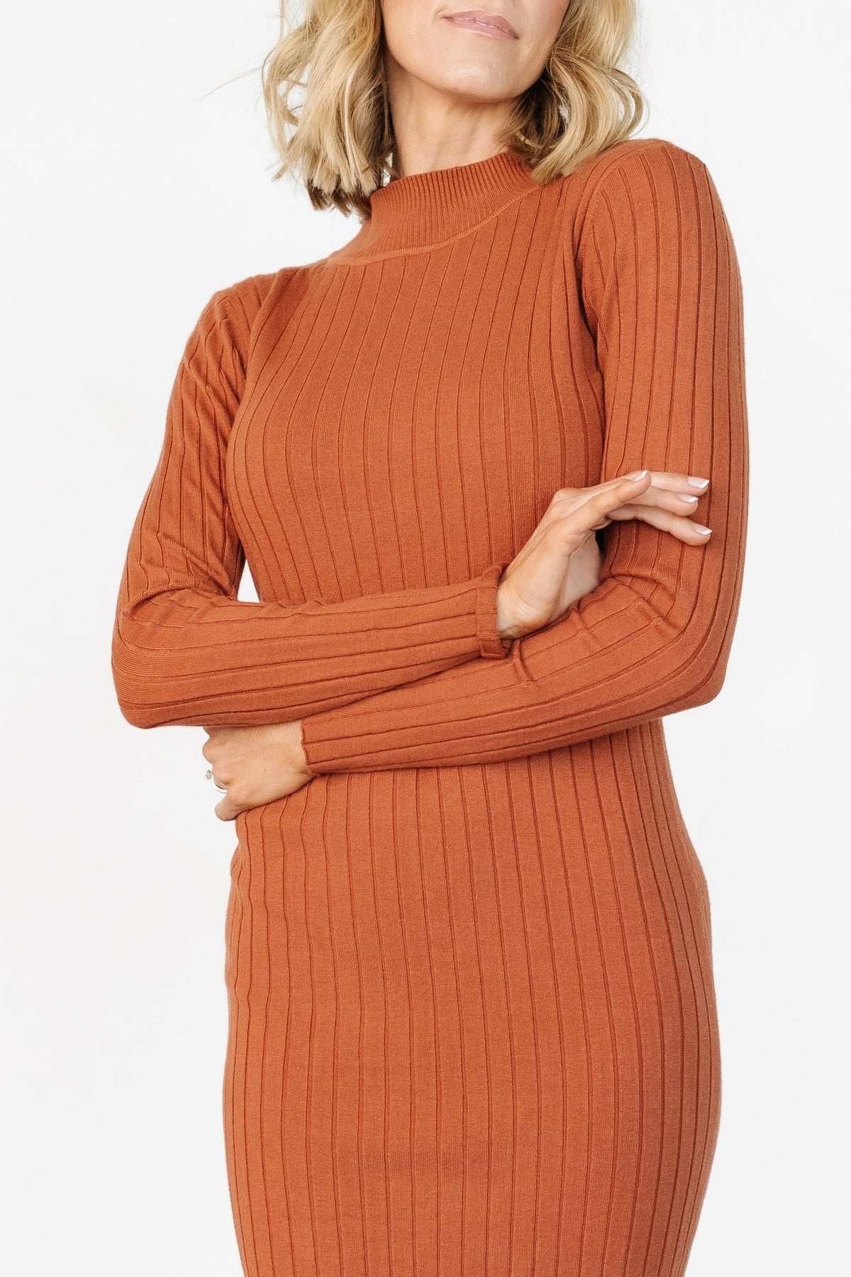 Close-up detail of the wide-rib knit fabric on the Jill Midi Dress, displaying texture, stitch definition, and the viscose-blend fiber finish.