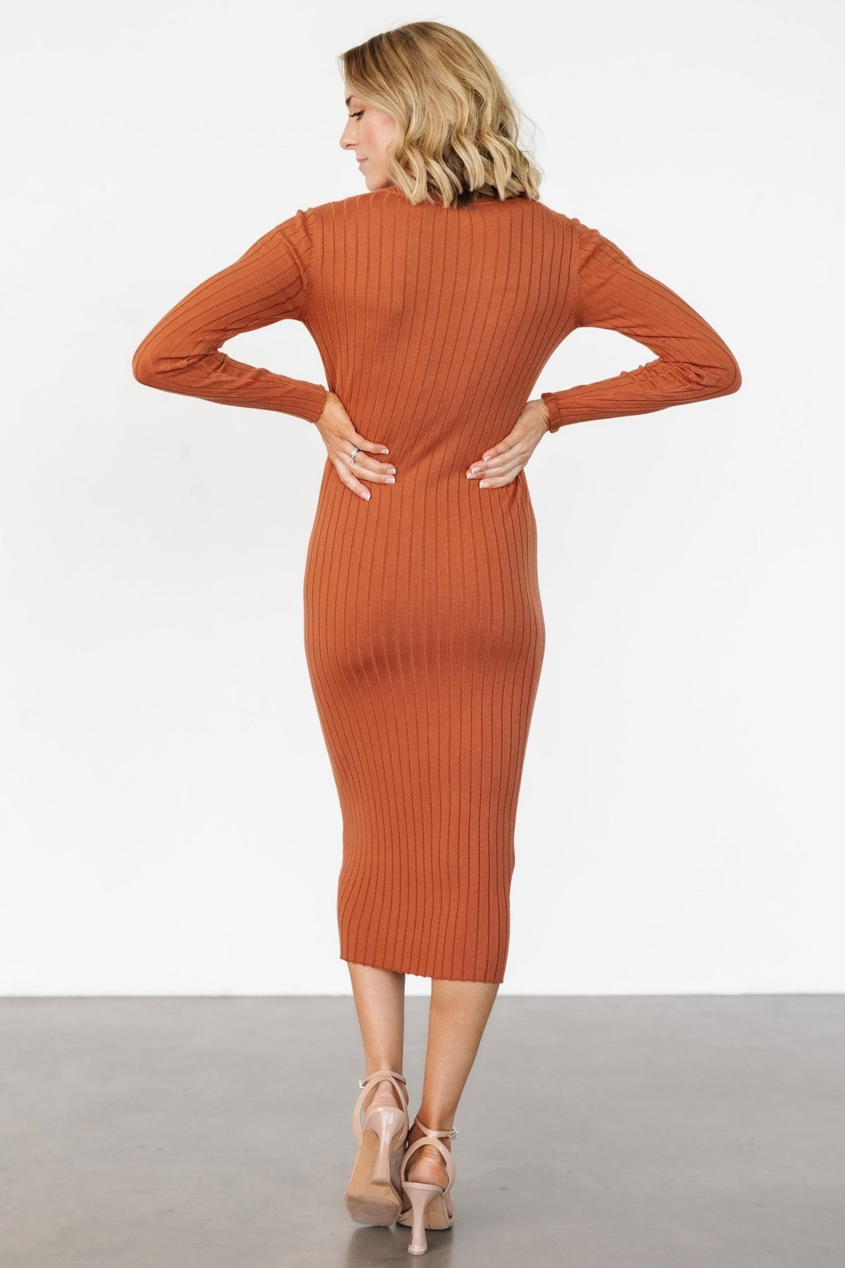 Detail shot of sleeve and cuff on the Jill Ribbed Midi Dress, highlighting fitted sleeve construction and consistent wide-rib patterning.