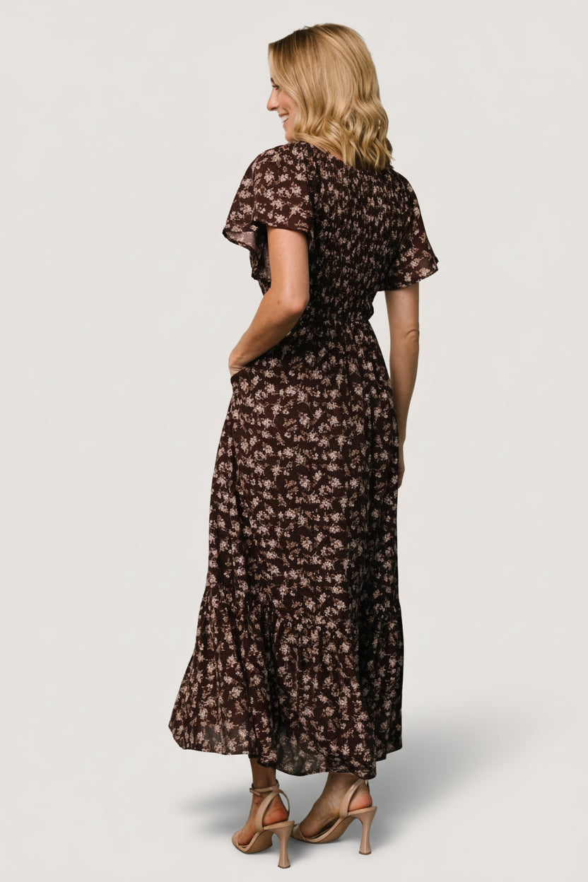 Detail image of flutter sleeve and shoulder smocking on the clove floral Joanie midi dress, showing sleeve length and gather.