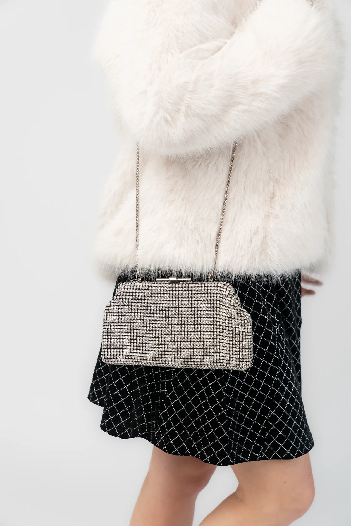 Julie Evening Clutch Bag with silver rhinestones, structured silhouette, clasp closure, and detachable chain strap.