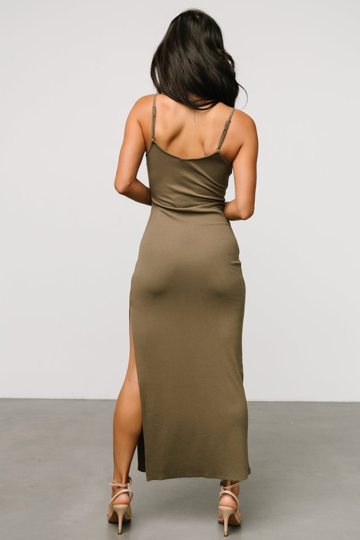 Styled look: Kade dusty olive bodycon dress paired with minimal accessories, showing versatility from casual to dressed-up looks.