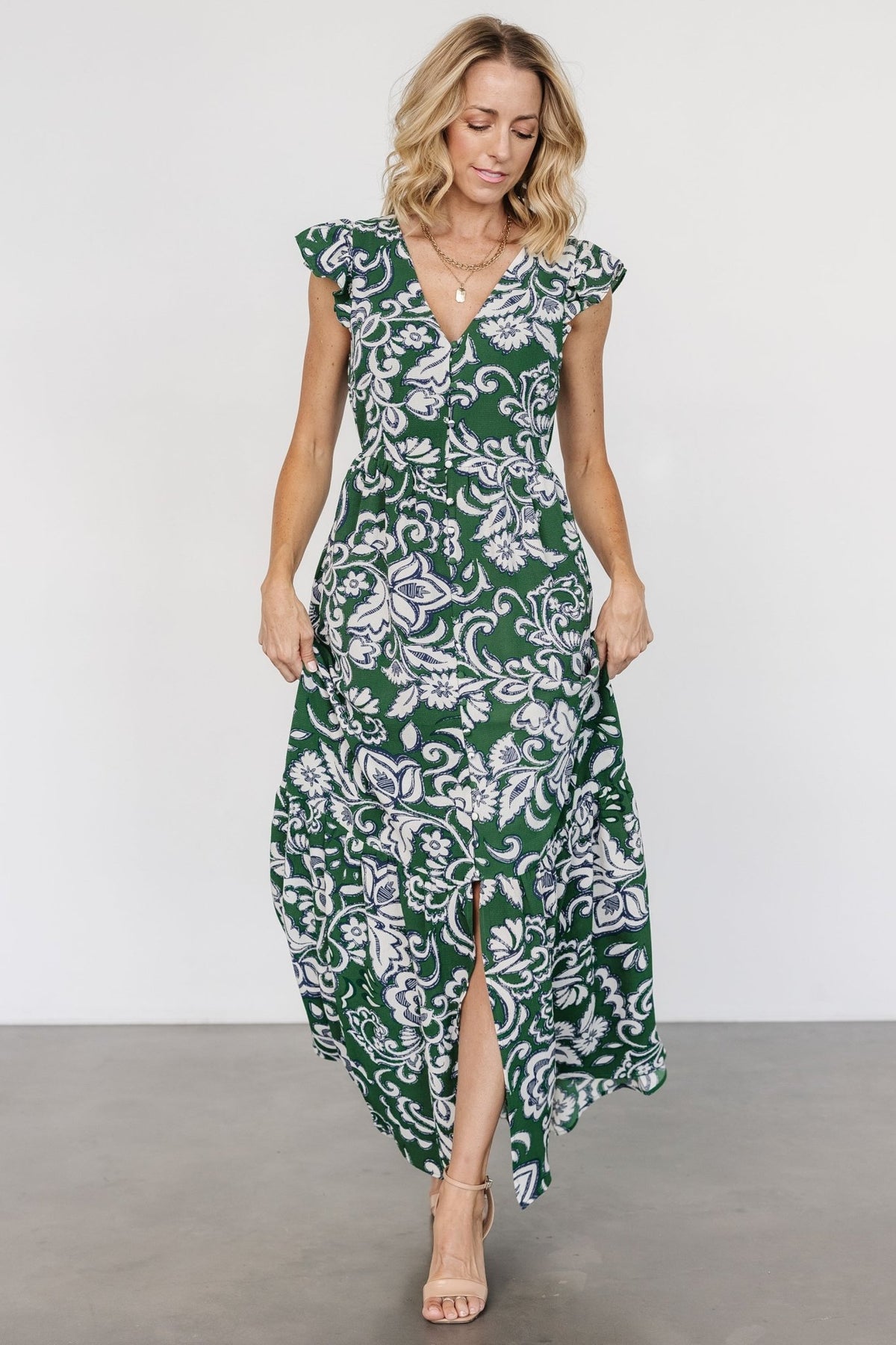 Styled outfit shot of Kaia Button Maxi Dress paired with sandals to show everyday wearability and the dress’s relaxed, airy movement.