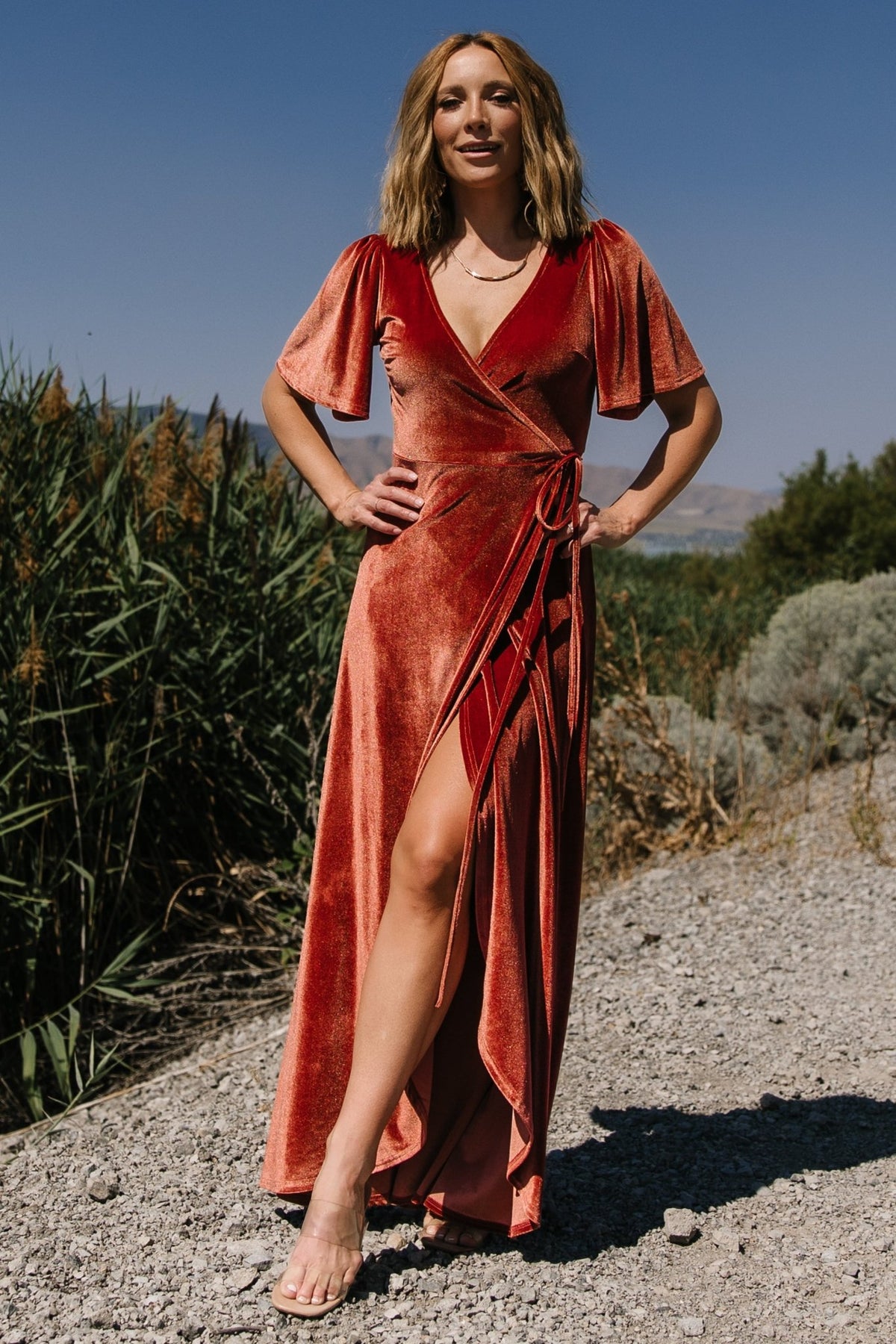 Styled studio image of the Cinnamon velvet Katelyn dress on mannequin or model, demonstrating fit, length and elegant velvet texture under studio lighting.