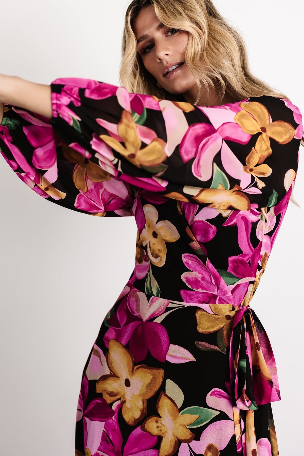 Side view of the Katinka Wrap Maxi Dress illustrating the flowing maxi skirt, wrap silhouette, and natural movement of the chiffon fabric.