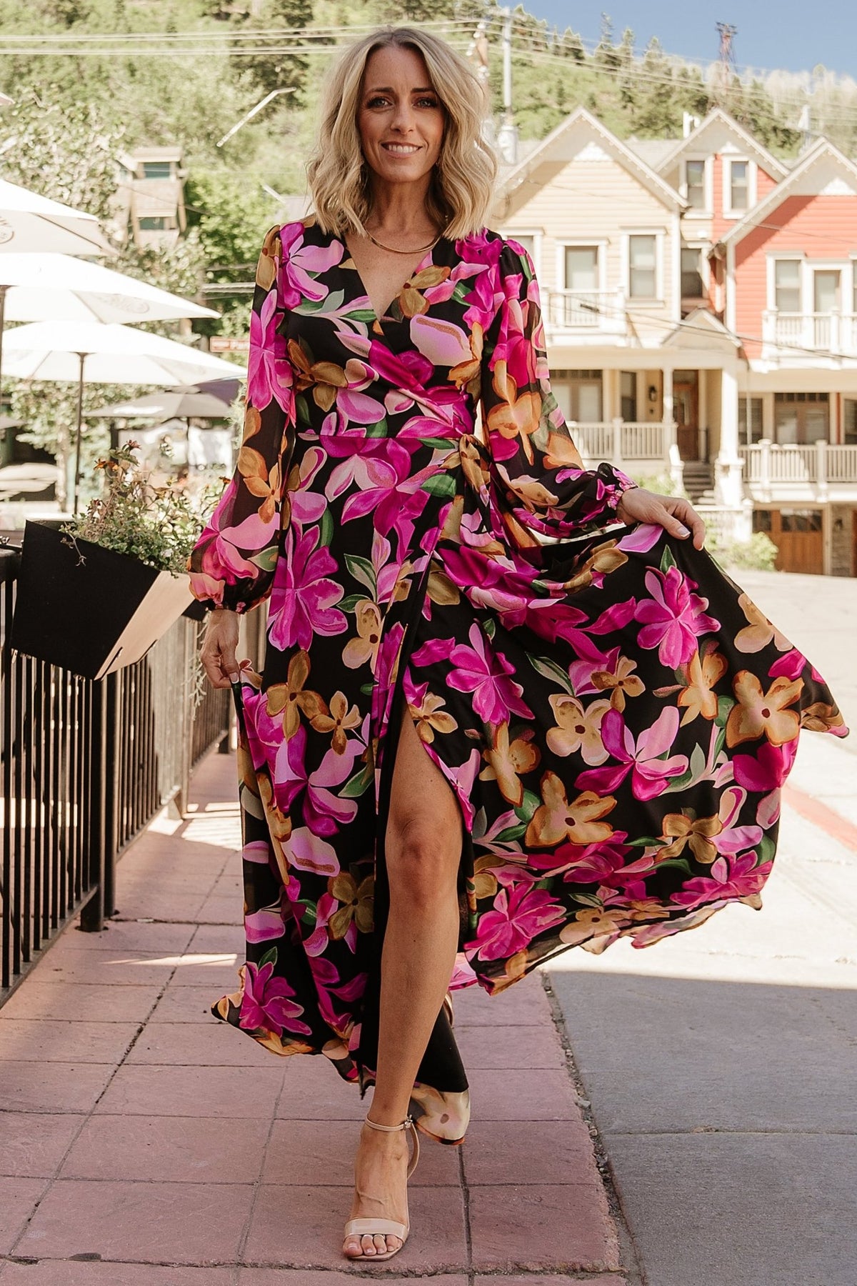 Full-length image of the Katinka Wrap Maxi Dress on a model walking, showing skirt movement, wrap closure, and overall maxi proportion.