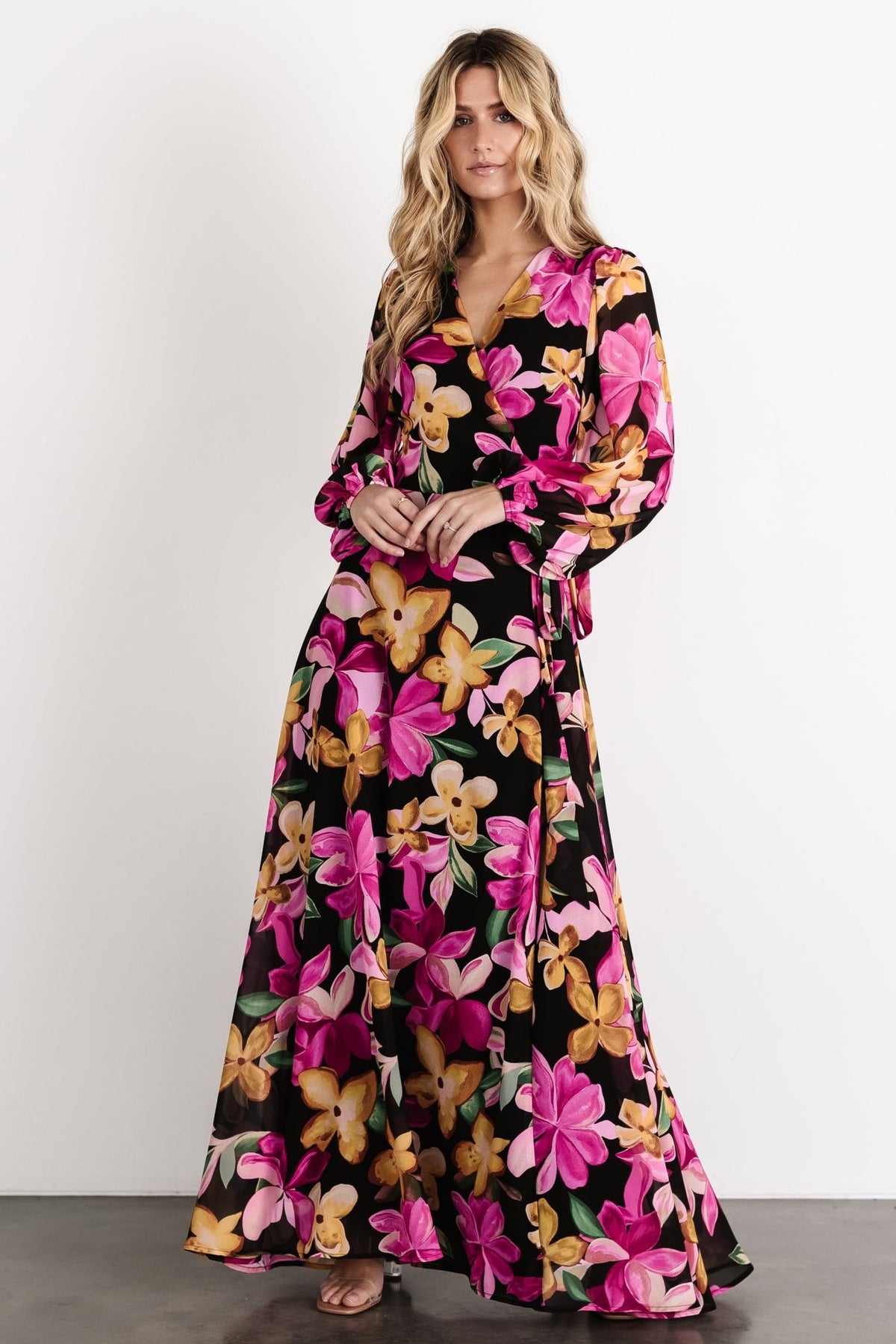 Close view of the Katinka Wrap Maxi Dress waist tie and surplice neckline, emphasizing the adjustable wrap design and feminine shape.
