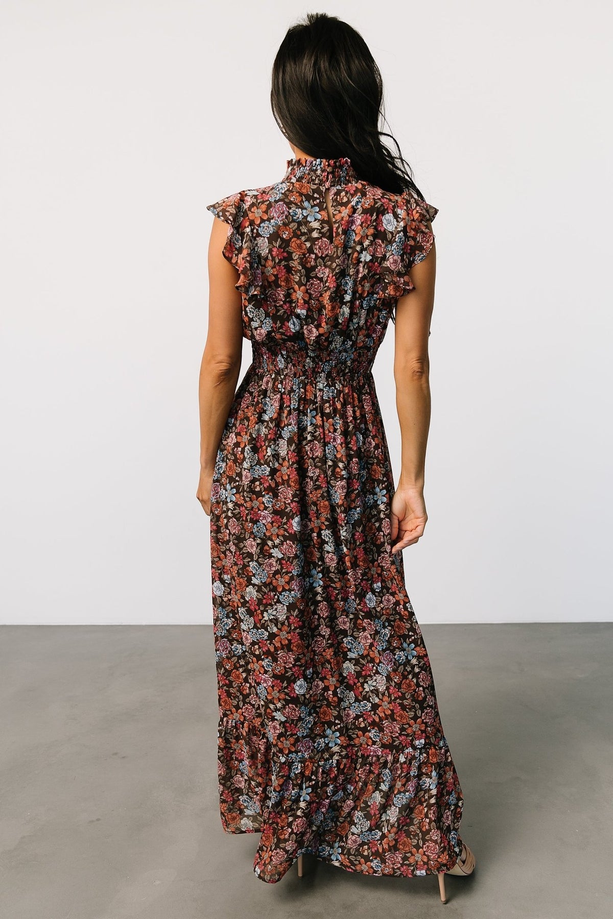 Detail image of the chiffon fabric and floral pattern, showing print scale and the fully lined body versus unlined sleeves.