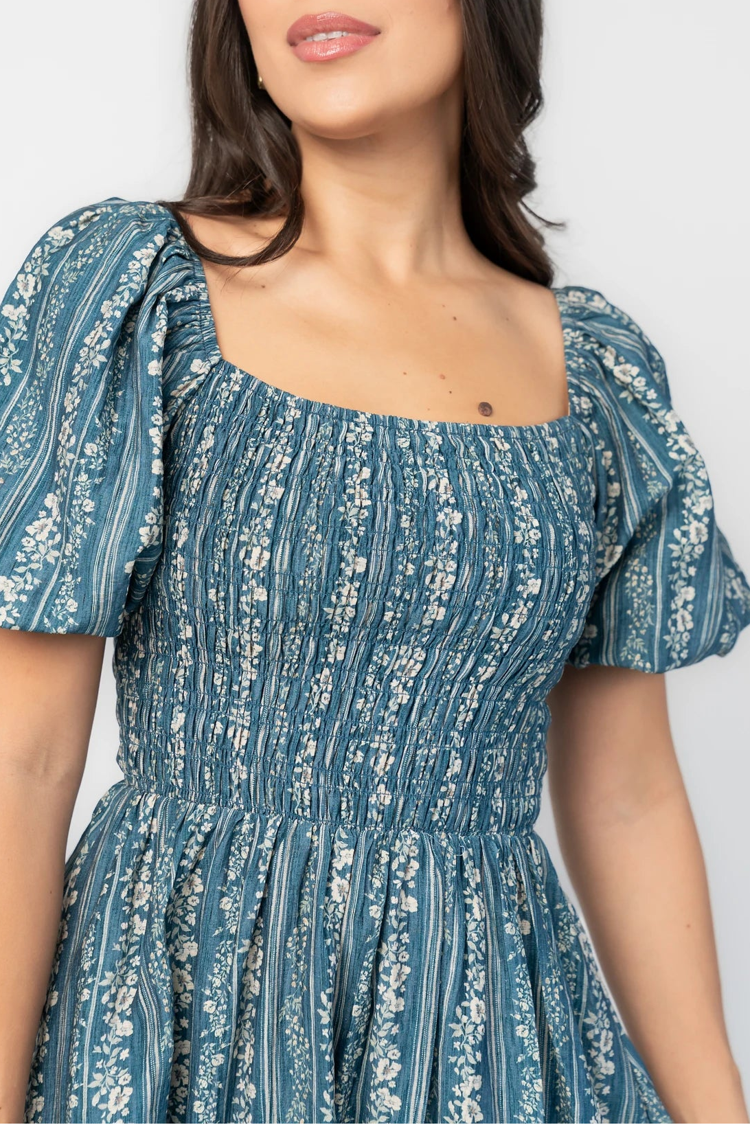 Keira Midi Dress in Blue Print with square neckline, smocked bodice, short puff sleeves, and midi skirt.