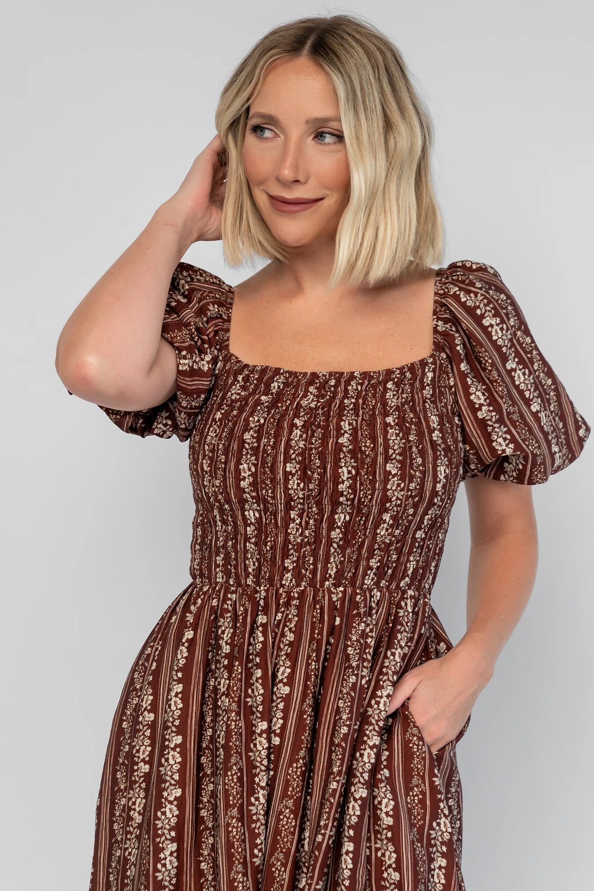 Keira Midi Dress in Mahogany Print with a square neckline, smocked bodice, and short puff sleeves.