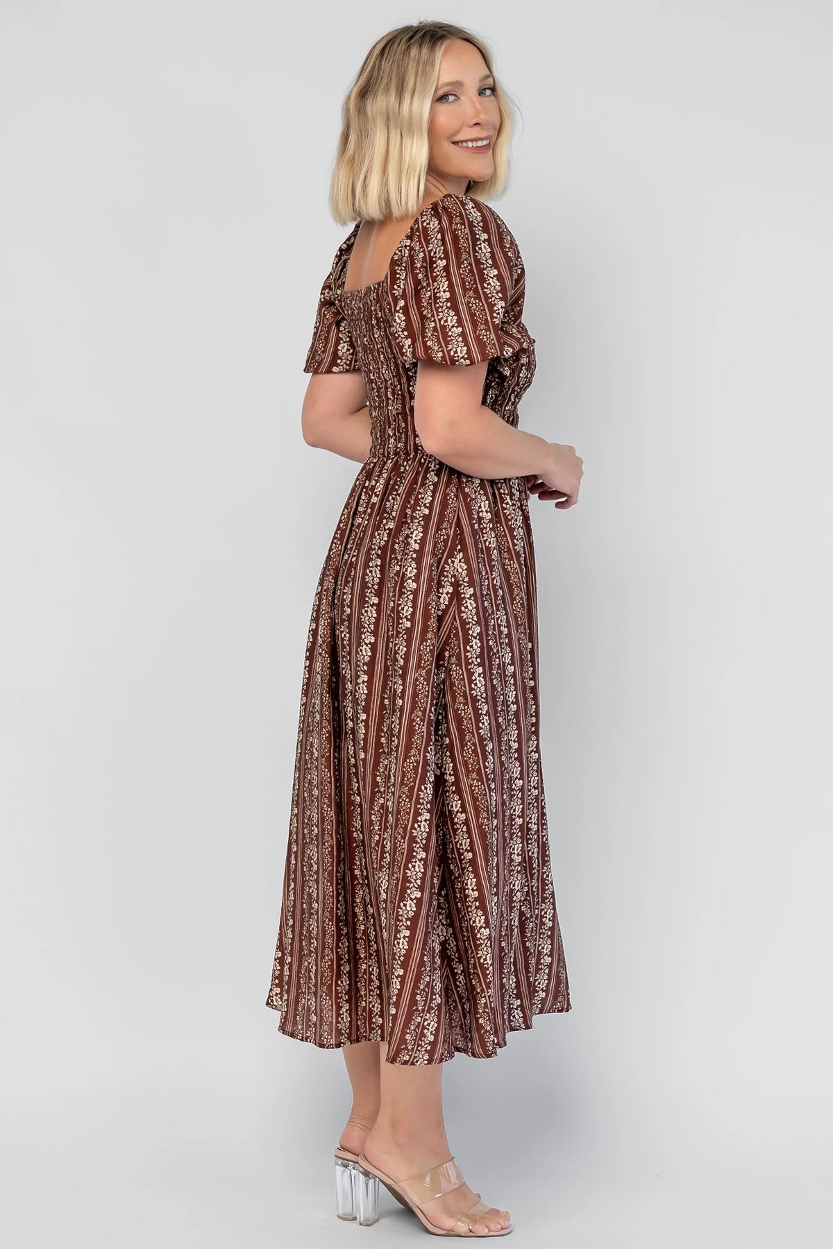 Keira Midi Dress in Mahogany Print with a square neckline, smocked bodice, and short puff sleeves.