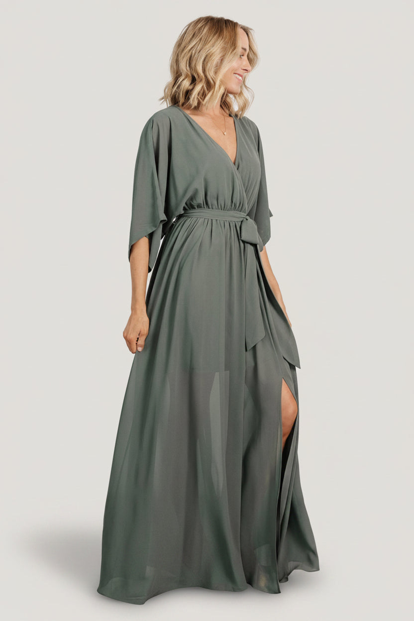 Close-up of surplice neckline and kimono sleeve detail on dark sage Kia maxi dress, showing fabric drape and finish.