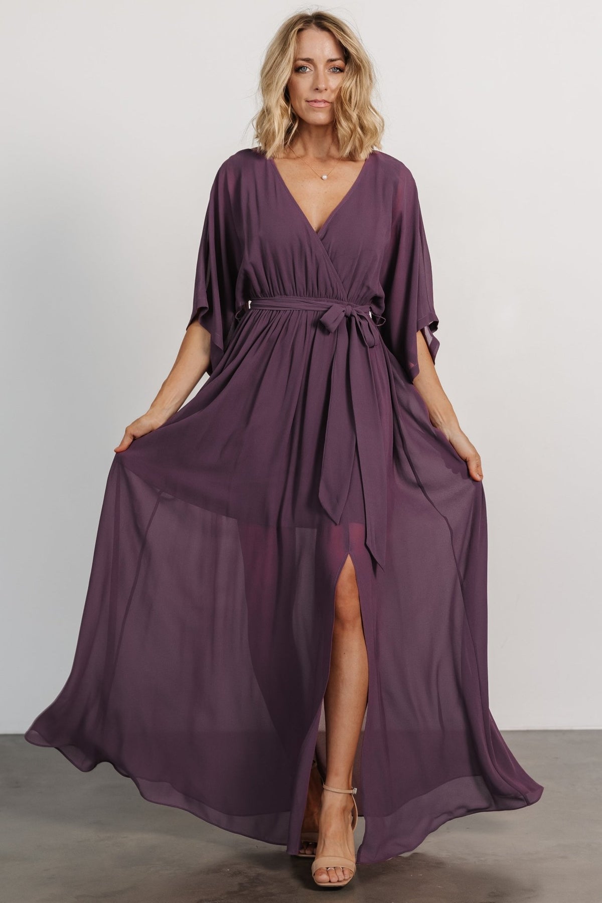 Styled look of the Kia Kimono Maxi Dress in vintage plum paired with neutral accessories, demonstrating its versatility for showers, weddings, and travel.