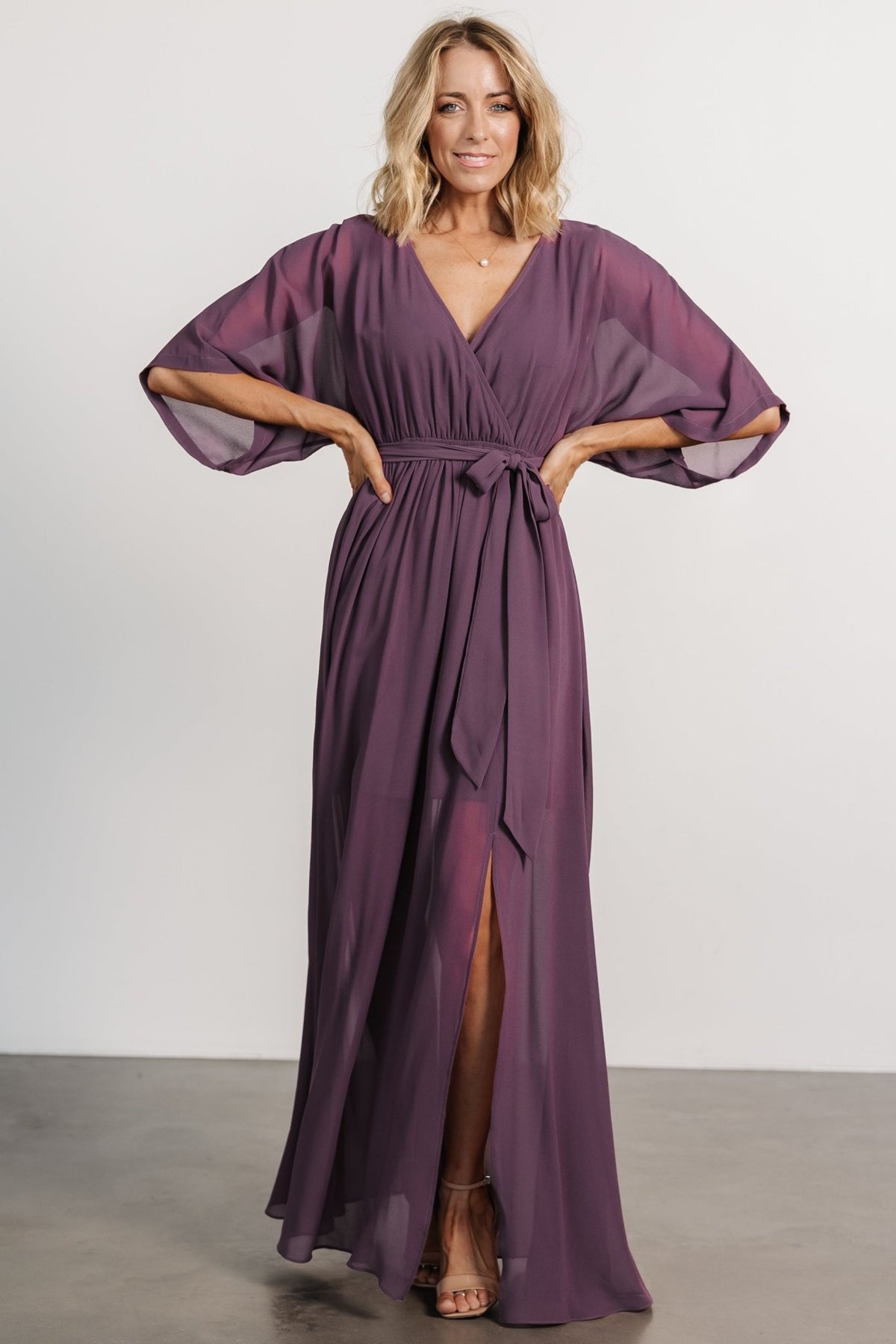 Close-up of the Kia Kimono Maxi Dress fabric in vintage plum showing lightweight texture, surplice neckline detail, and kimono sleeve drape.