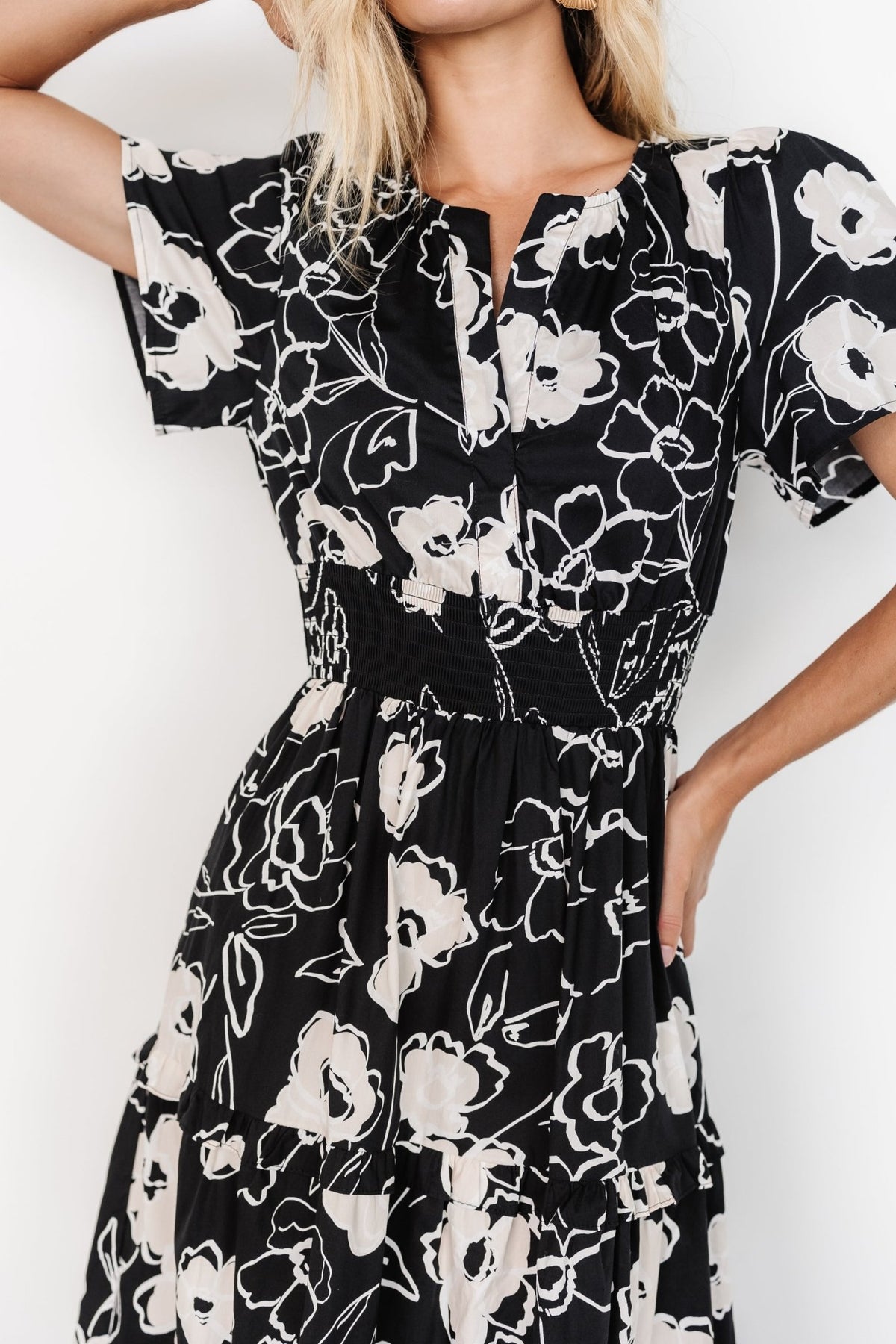 Side close-up of Kiana Poplin Maxi Dress showing a functional side pocket, black and cream print and cotton texture.