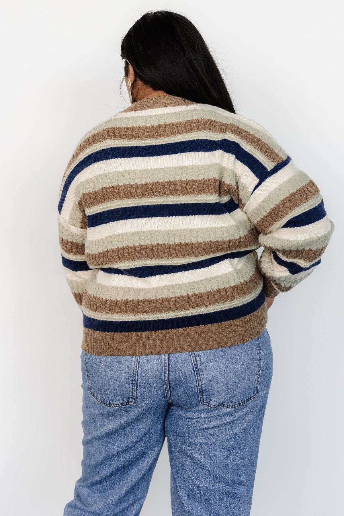 Back view of Kira Striped Sweater revealing consistent multi-stripe pattern across the body and finished ribbed trims.