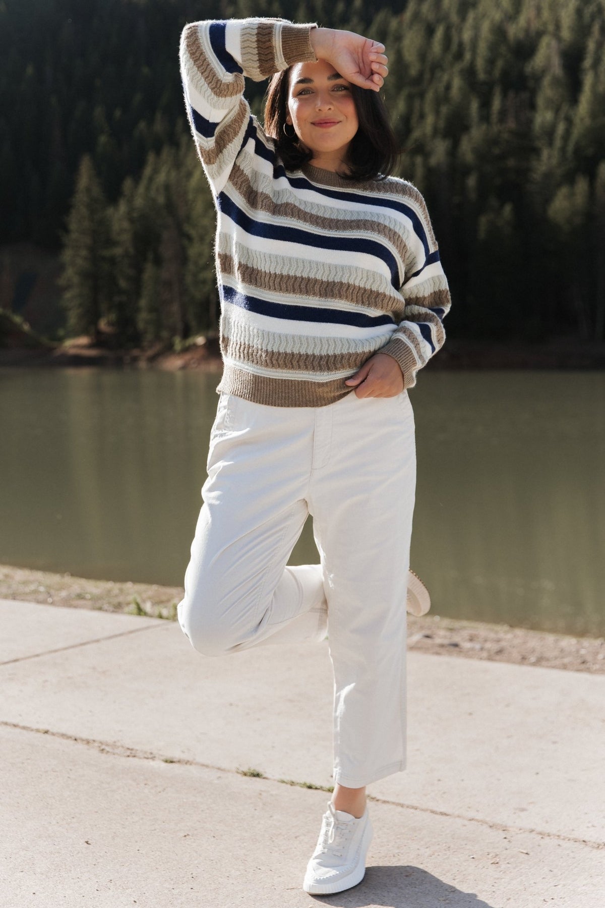 Flat-lay of the Kira Striped Sweater in navy and sage multi, displaying full stripe placement, round neckline, and hemline shape.