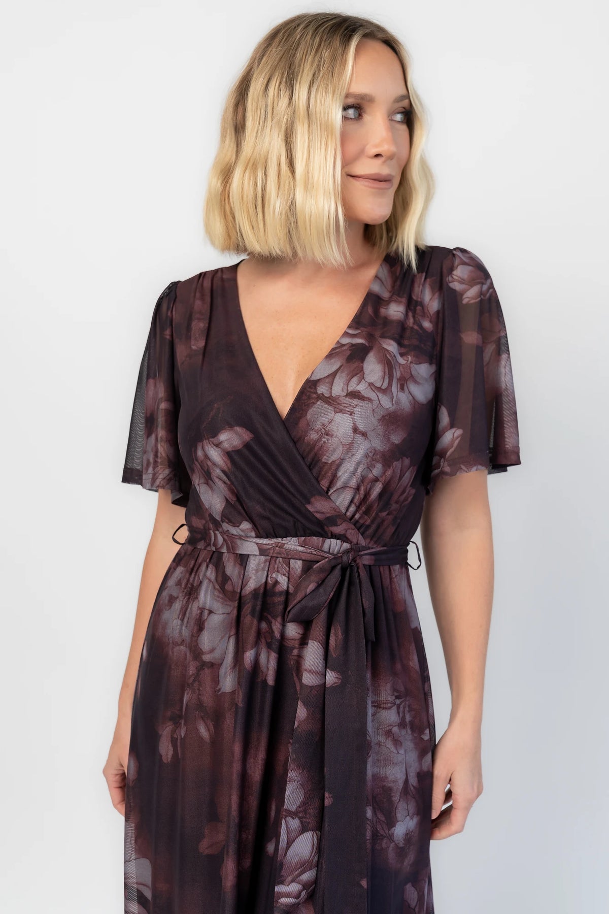 Kristina Mesh Maxi Dress in Dark Clove Floral with crossover neckline, elastic waist, and side slit.