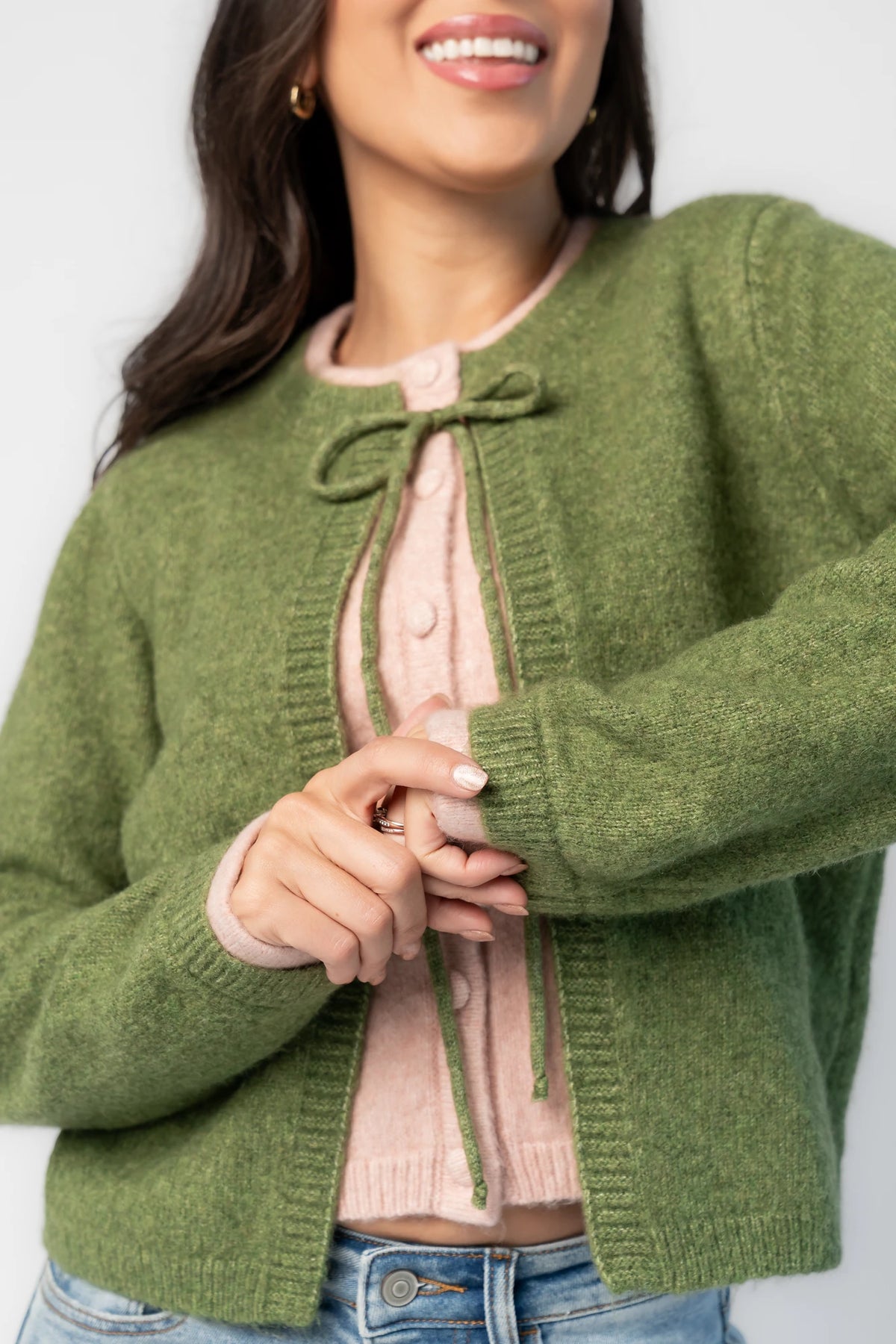 Landry Cardigan in Blush + Green with layered pink button-front panel, green front ties, crew neckline, and long sleeves.