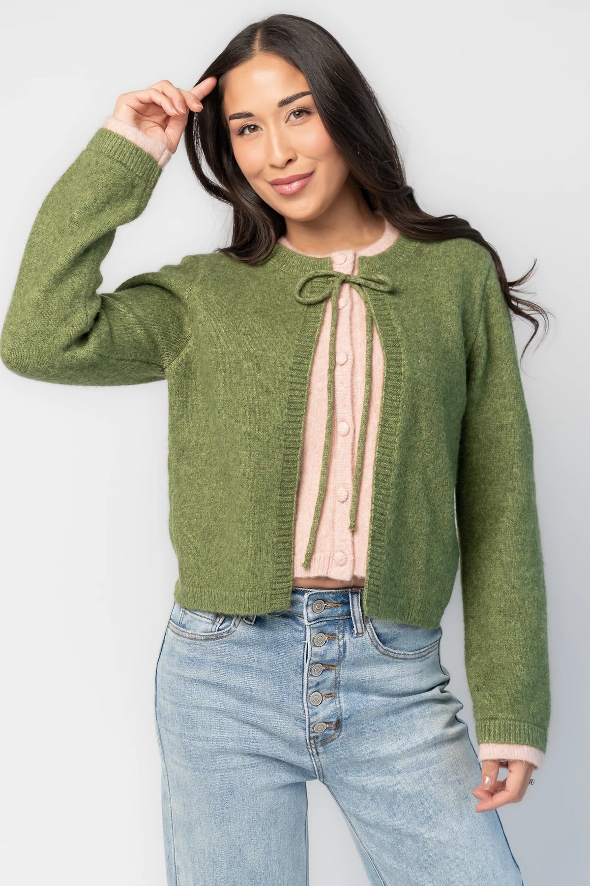Landry Cardigan in Blush + Green with layered pink button-front panel, green front ties, crew neckline, and long sleeves.