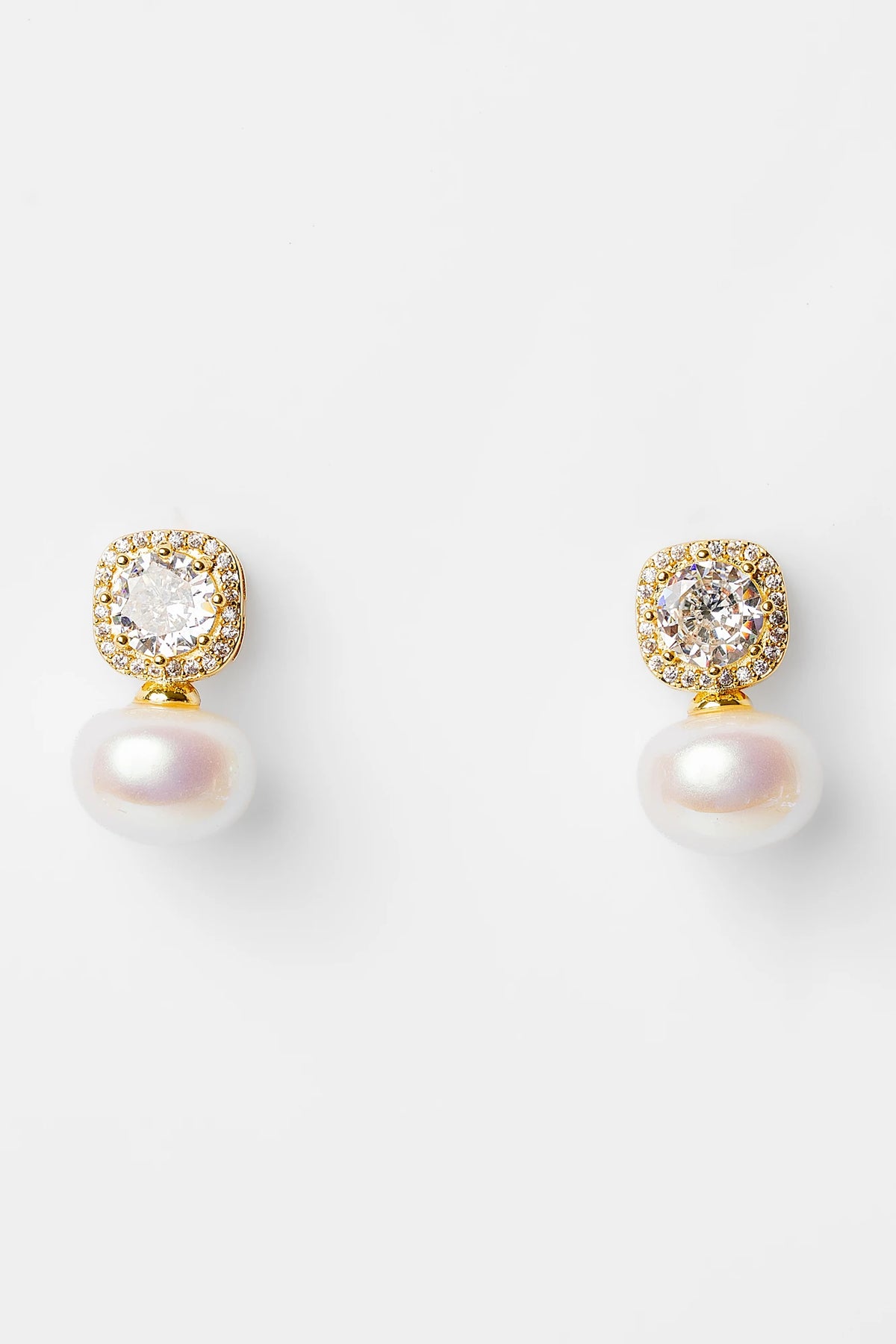 Laurent Pearl Halo Stud Earrings in Gold with cubic zirconia halo and faux pearl drop.