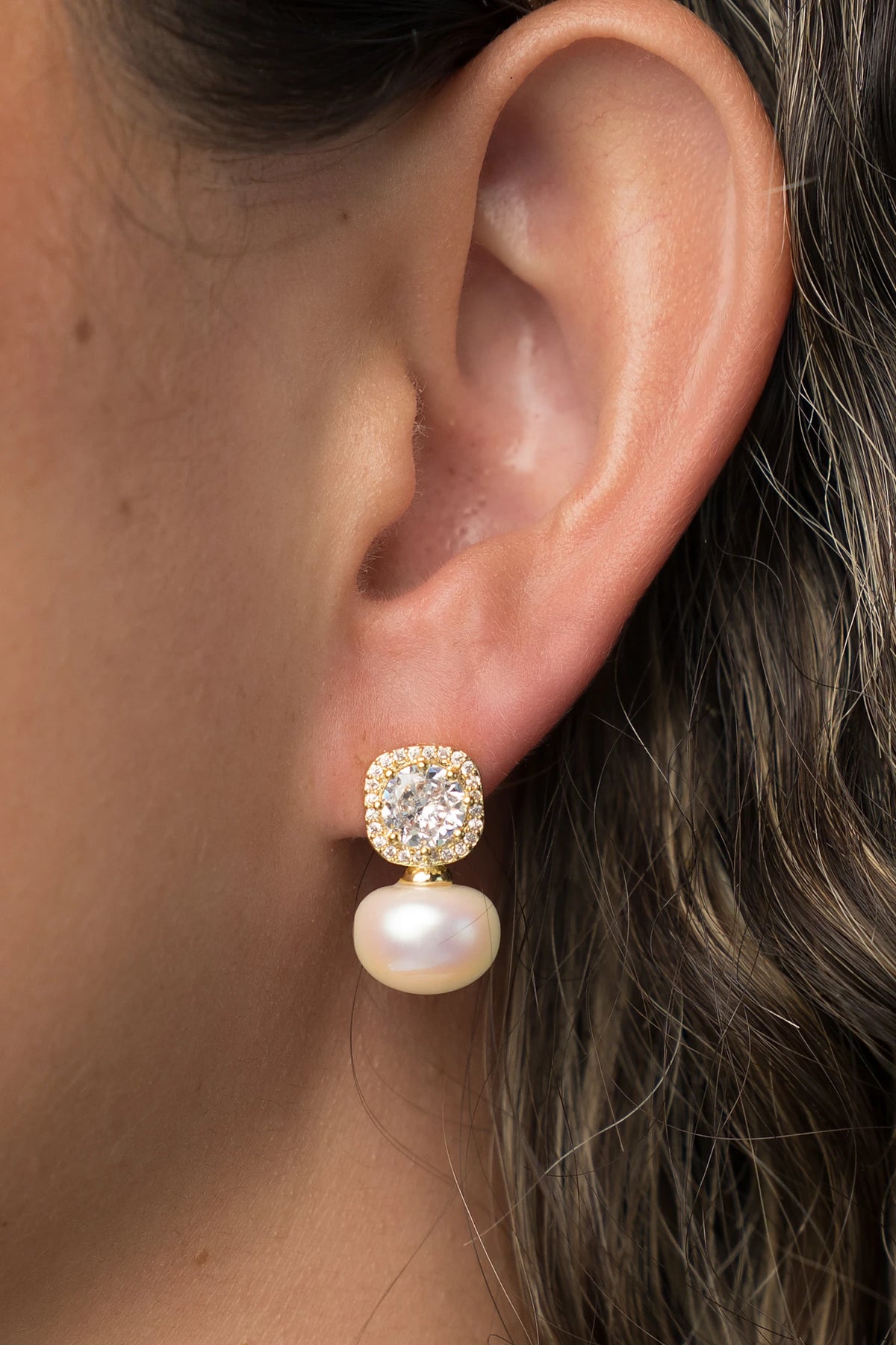 Laurent Pearl Halo Stud Earrings in Gold with cubic zirconia halo and faux pearl drop.