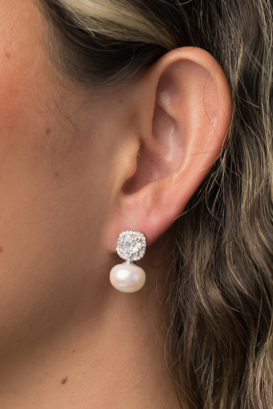 Laurent Pearl Halo Stud Earrings in Silver with cubic zirconia halo and faux pearl drop.