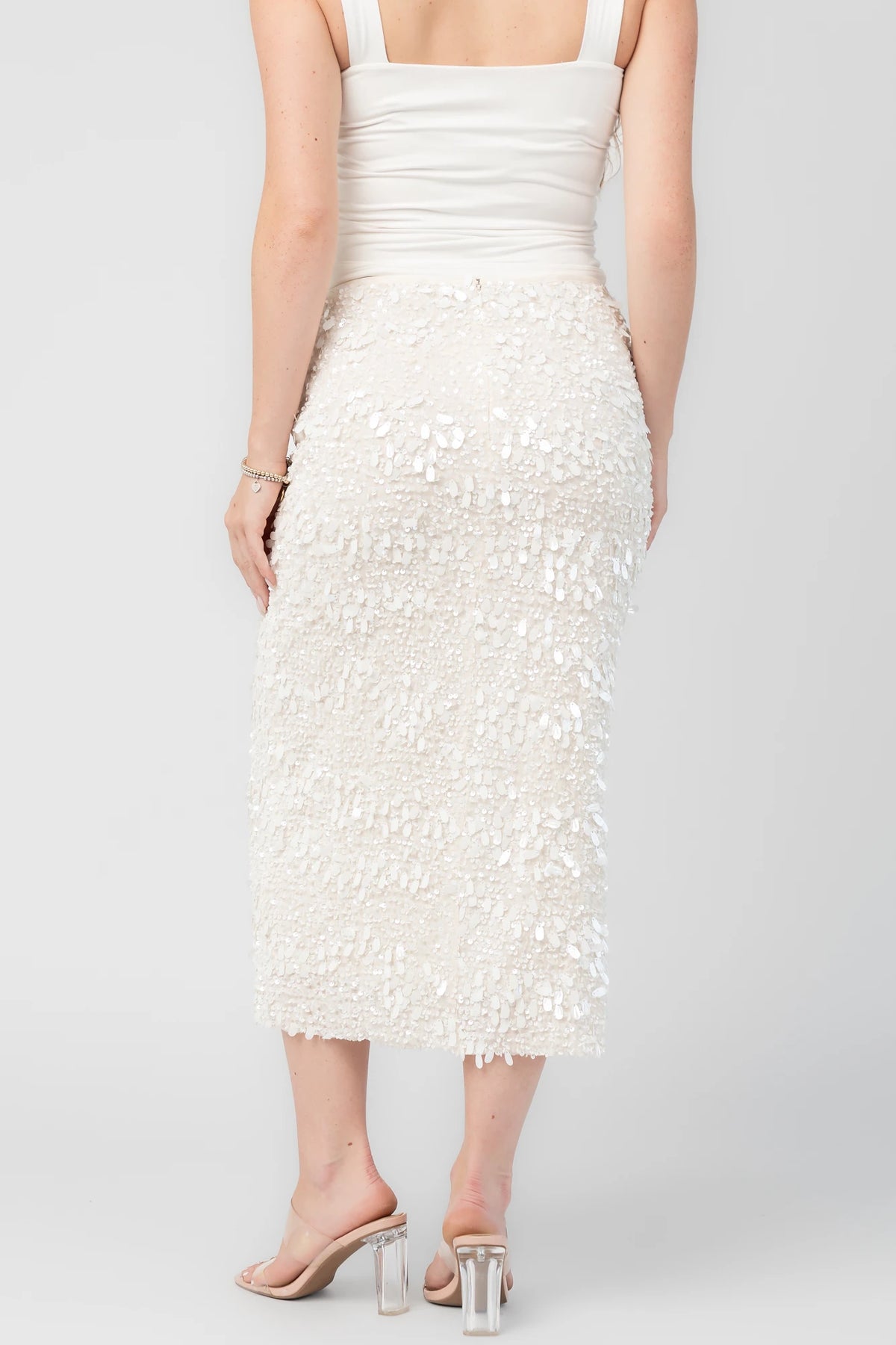 Lavana Sequin Skirt in Ivory with dimensional sequin embellishments, midi length, and fitted silhouette.
