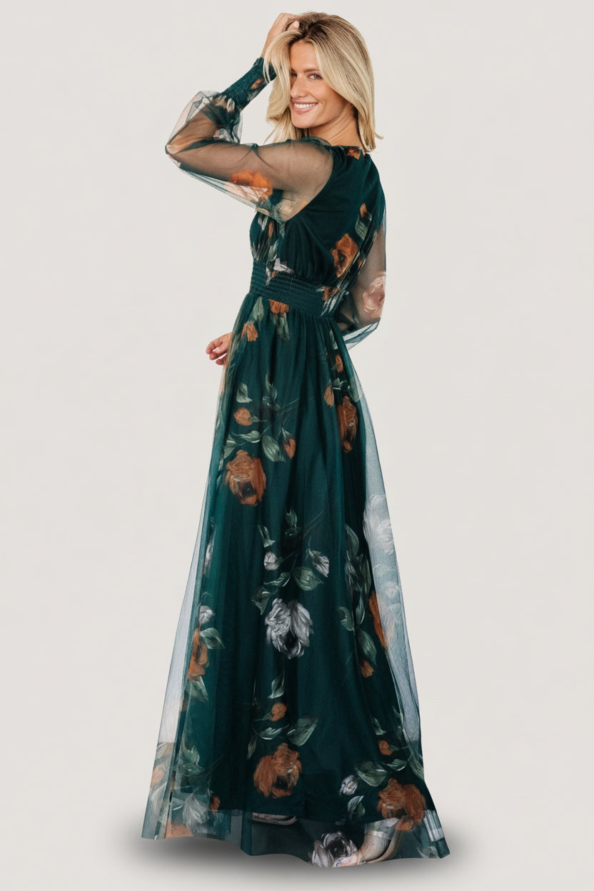 Back and side view of deep Topaz floral tulle maxi dress showing flow of skirt and sheer long sleeves with smocked cuffs.