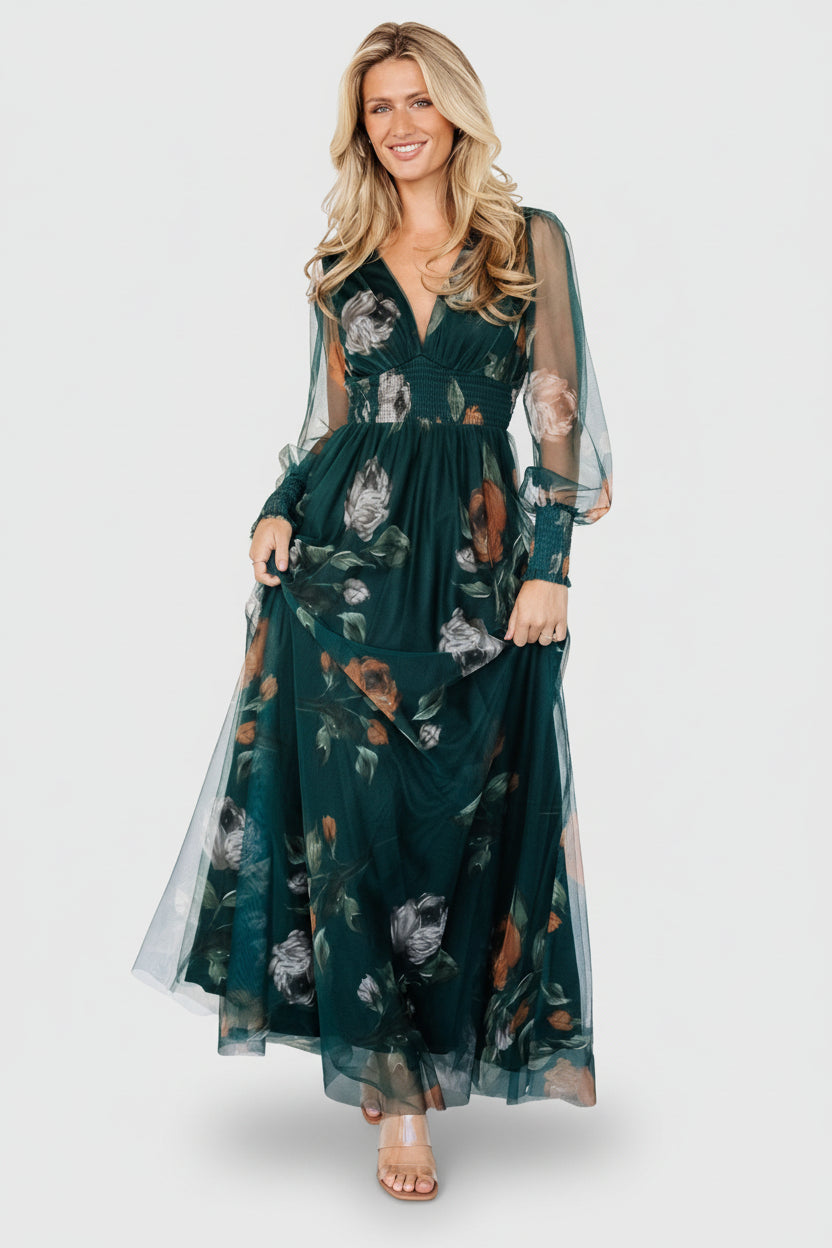 Long tulle maxi dress in deep Topaz green floral print with V-neckline, smocked waist, long sheer sleeves and flowing skirt.