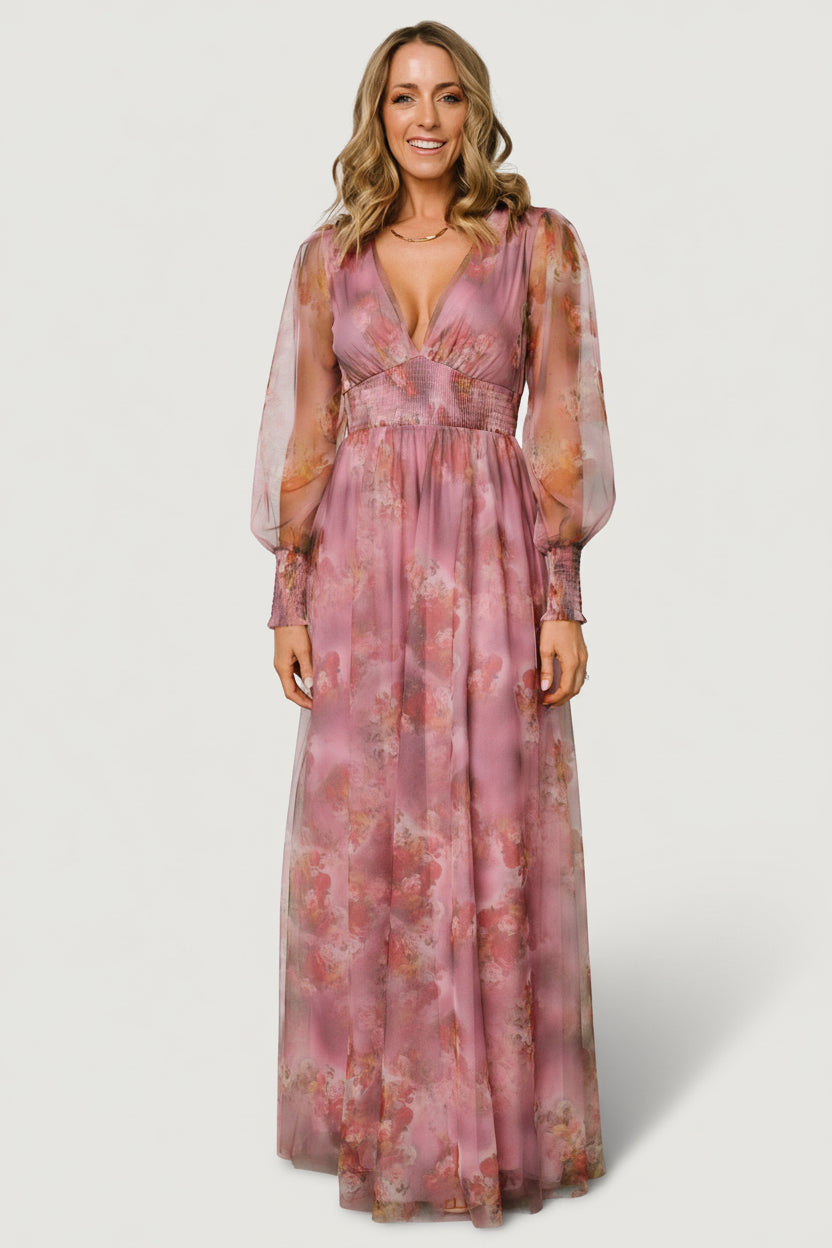 Back view of Layla Tulle Maxi Dress in Dusty Orchid Floral showing flowing skirt, gentle train, and overall silhouette in natural light.