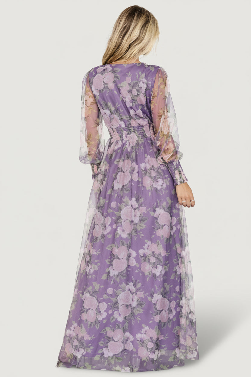 Three-quarter view of Layla Tulle Maxi Dress in lavender with blush florals, showing movement of layered tulle and raw hem finish.