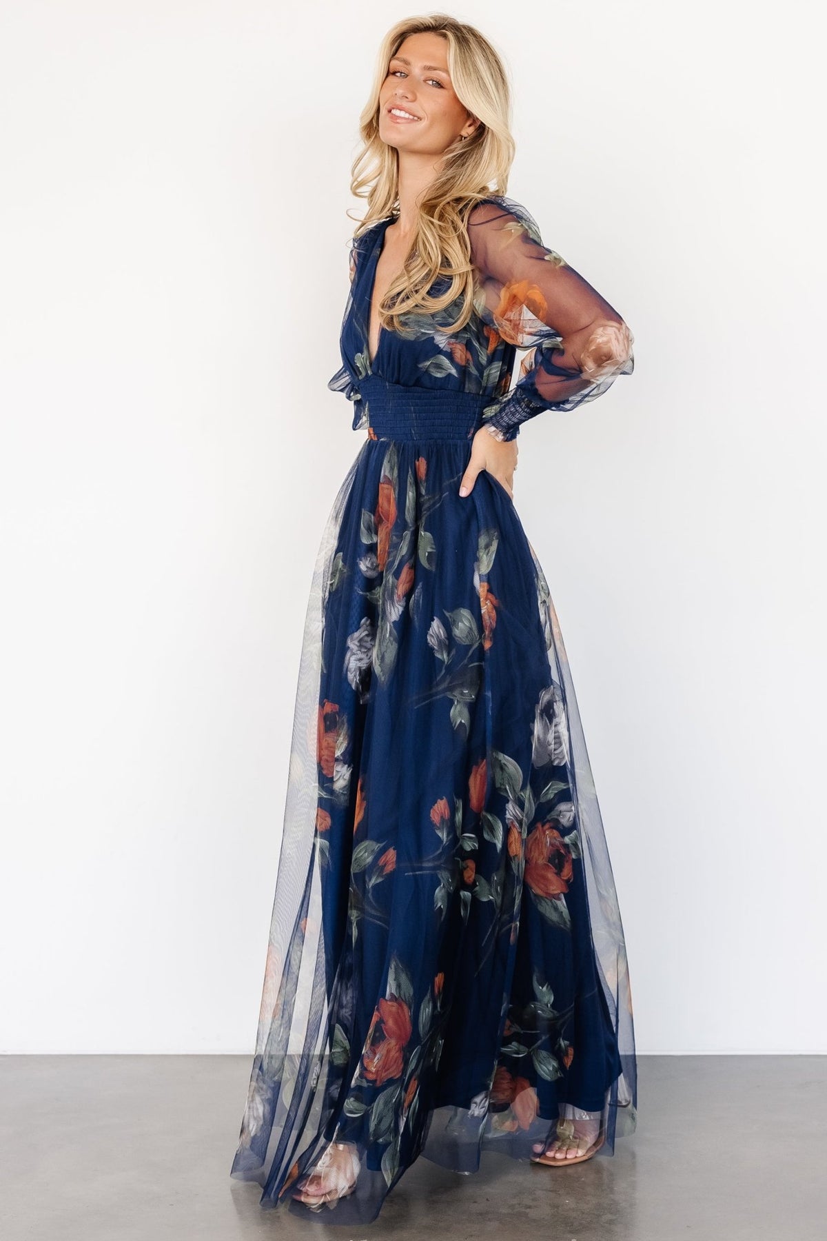 Model wearing Layla Tulle Maxi Dress in navy floral at an event, illustrating fit, movement, and styling options.