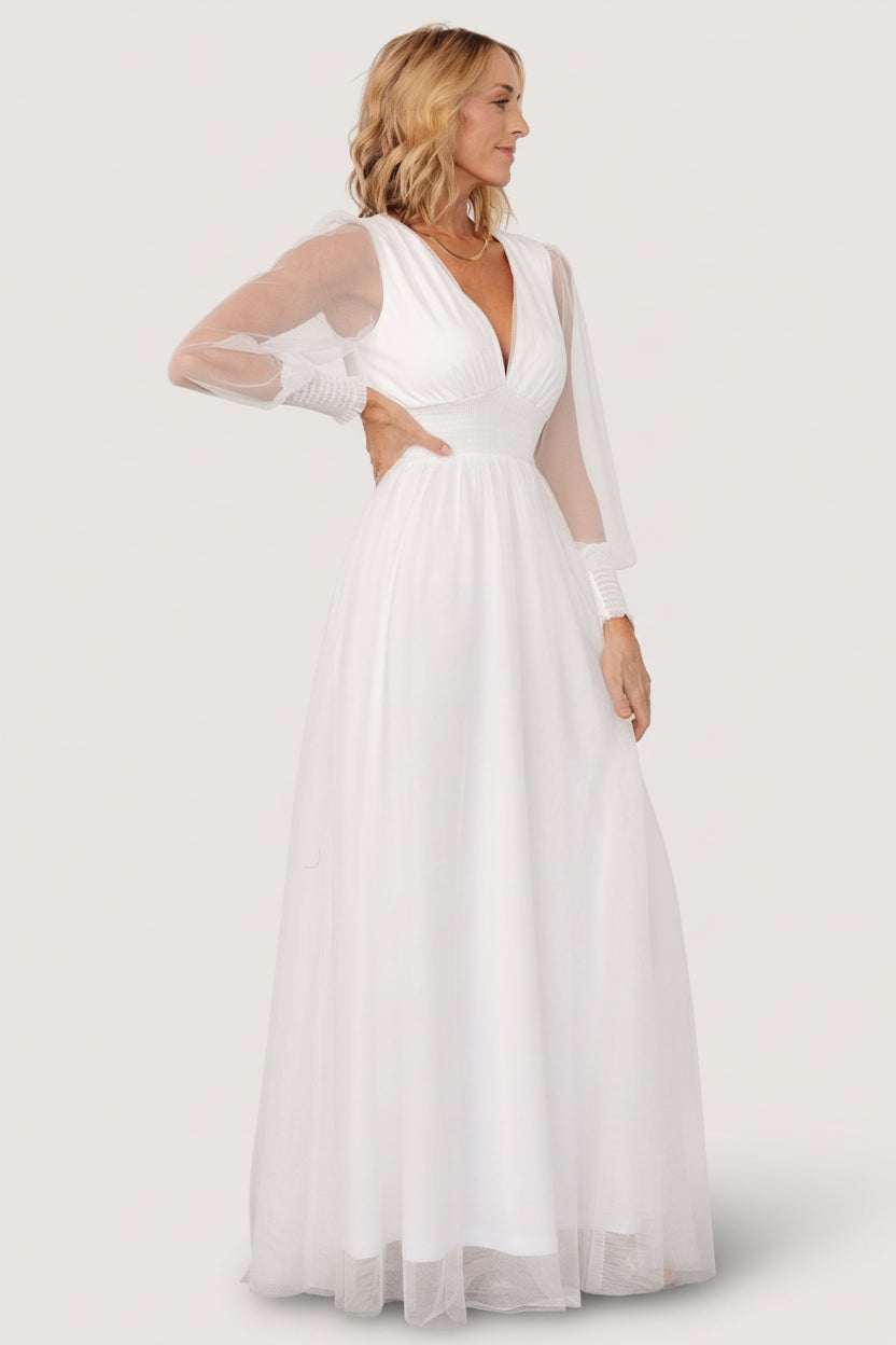 Detail shot of the smocked waist and bodice on the Layla Tulle Maxi Dress in white, showing texture and gentle stretch in the fabric.