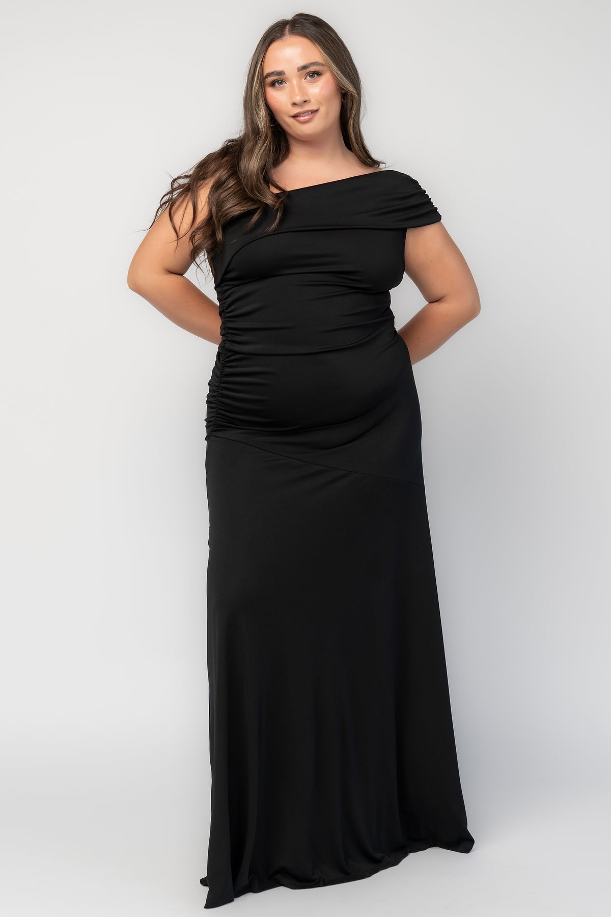Leon One Shoulder Gown with asymmetrical neckline, diagonal draping, side ruching, and fitted maxi silhouette.