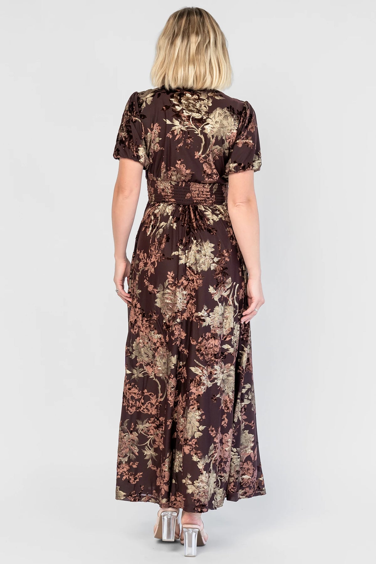 Leslie Velvet Maxi Dress in Brown + Metallic Gold with an embossed velvet floral design, a V-neckline, and puff sleeves.