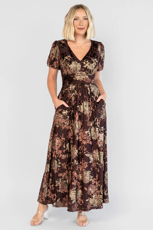 Leslie Velvet Maxi Dress in Brown + Metallic Gold with an embossed velvet floral design, a V-neckline, and puff sleeves.