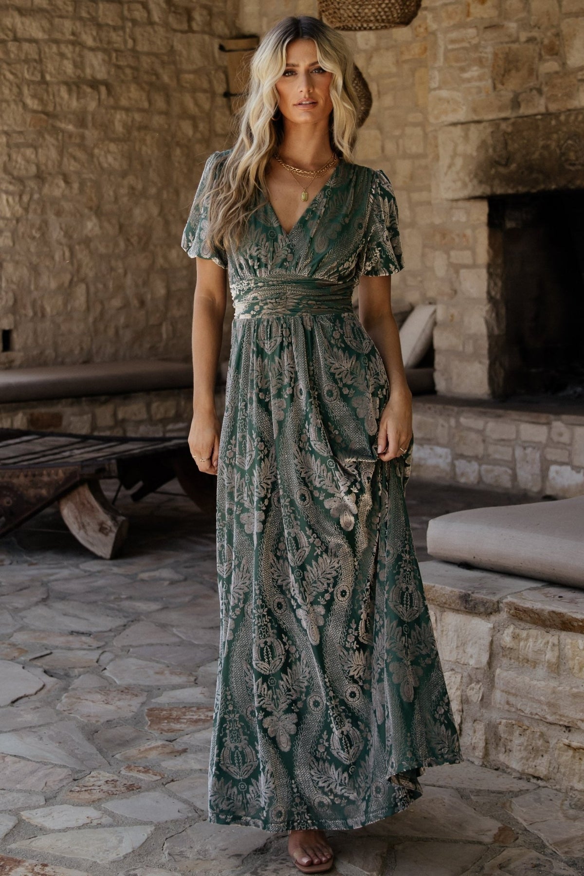 Back view of the Leslie Embossed Velvet Maxi in Sage + Silver showing neckline, sleeve finish, and full skirt length.
