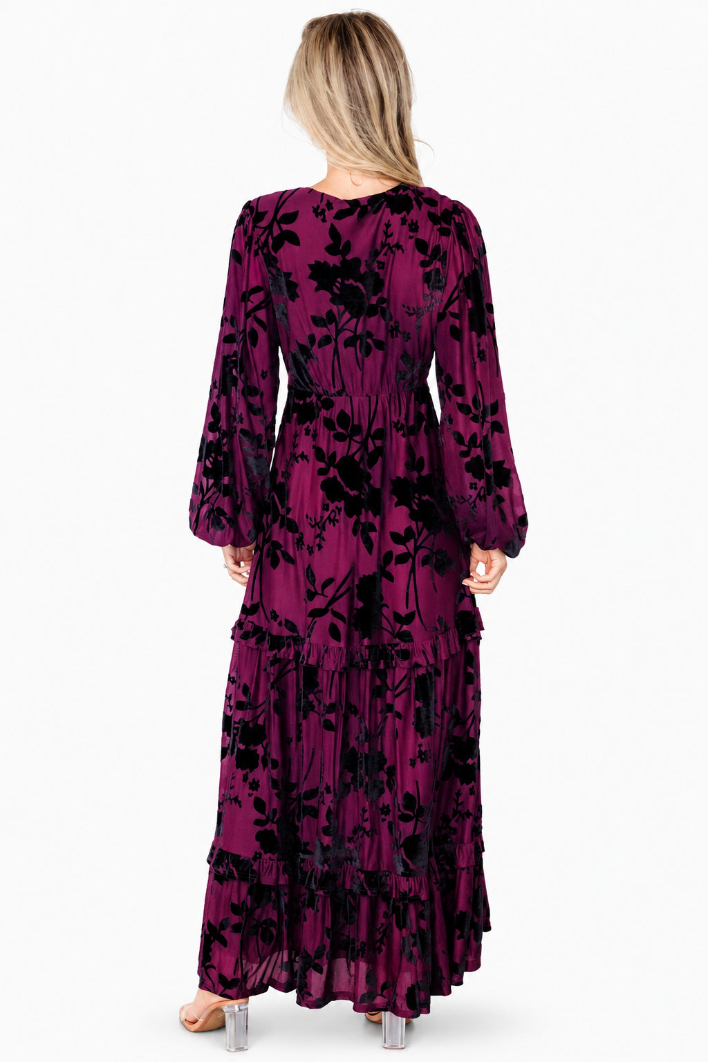 Front view of mulberry velvet burnout maxi dress with plunging V-neckline, long sleeves with elastic cuffs, and tiered ruffle hem.