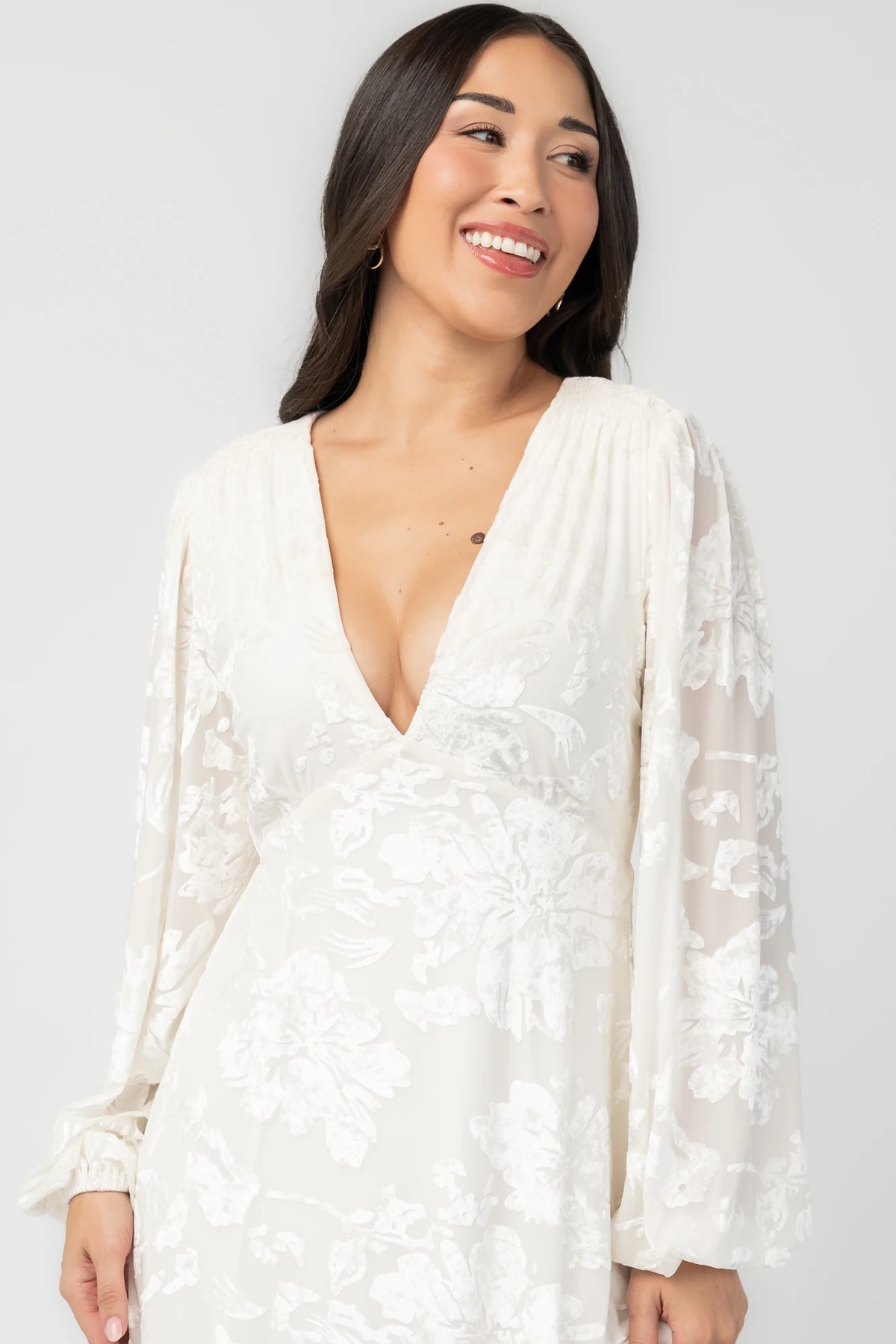 Liana Velvet Embossed Ruffle-Tier Maxi Dress in Ivory with V-neck, long sleeves, and ruffle-tiered skirt.