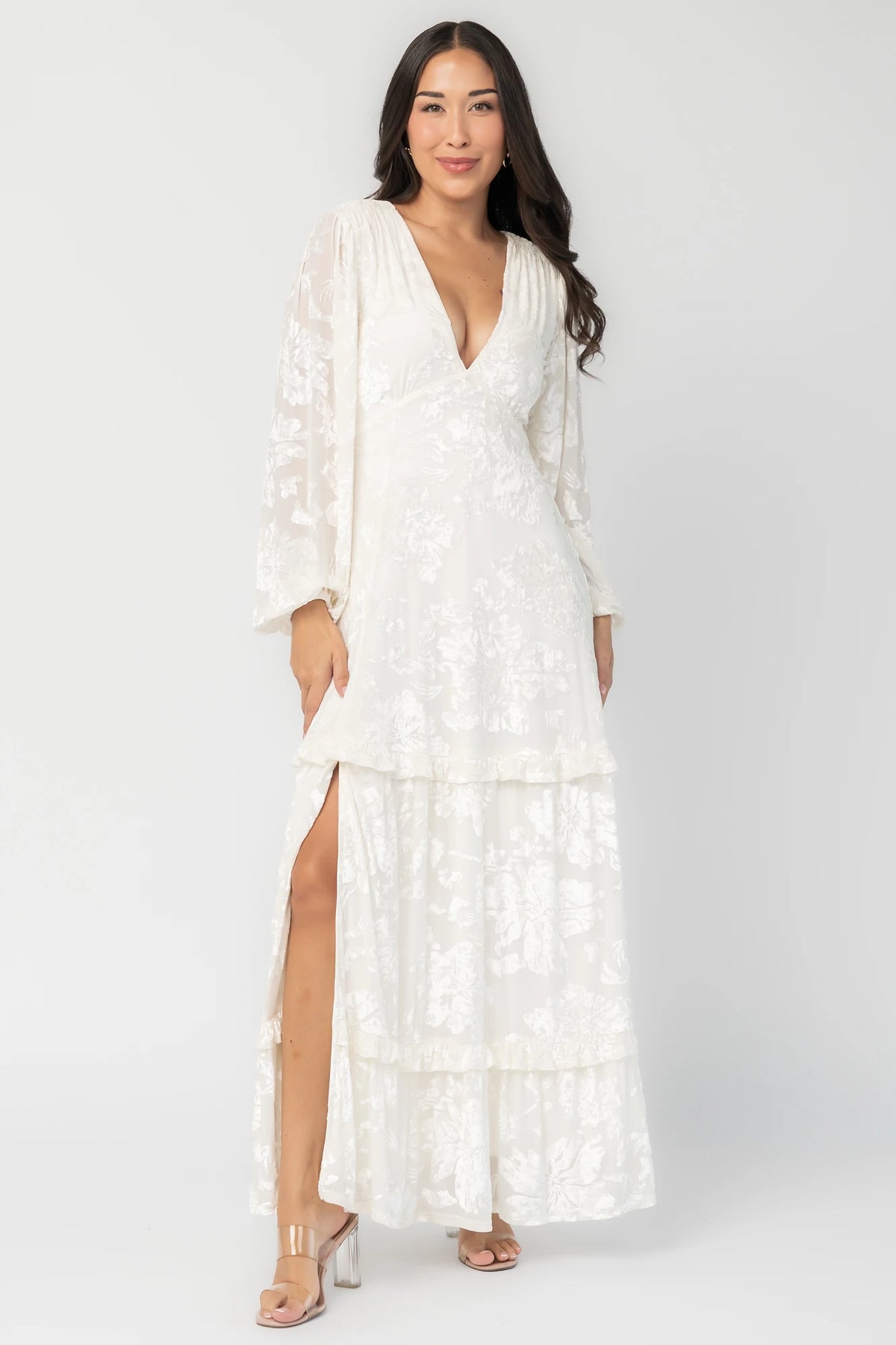 Liana Velvet Embossed Ruffle-Tier Maxi Dress in Ivory with V-neck, long sleeves, and ruffle-tiered skirt.