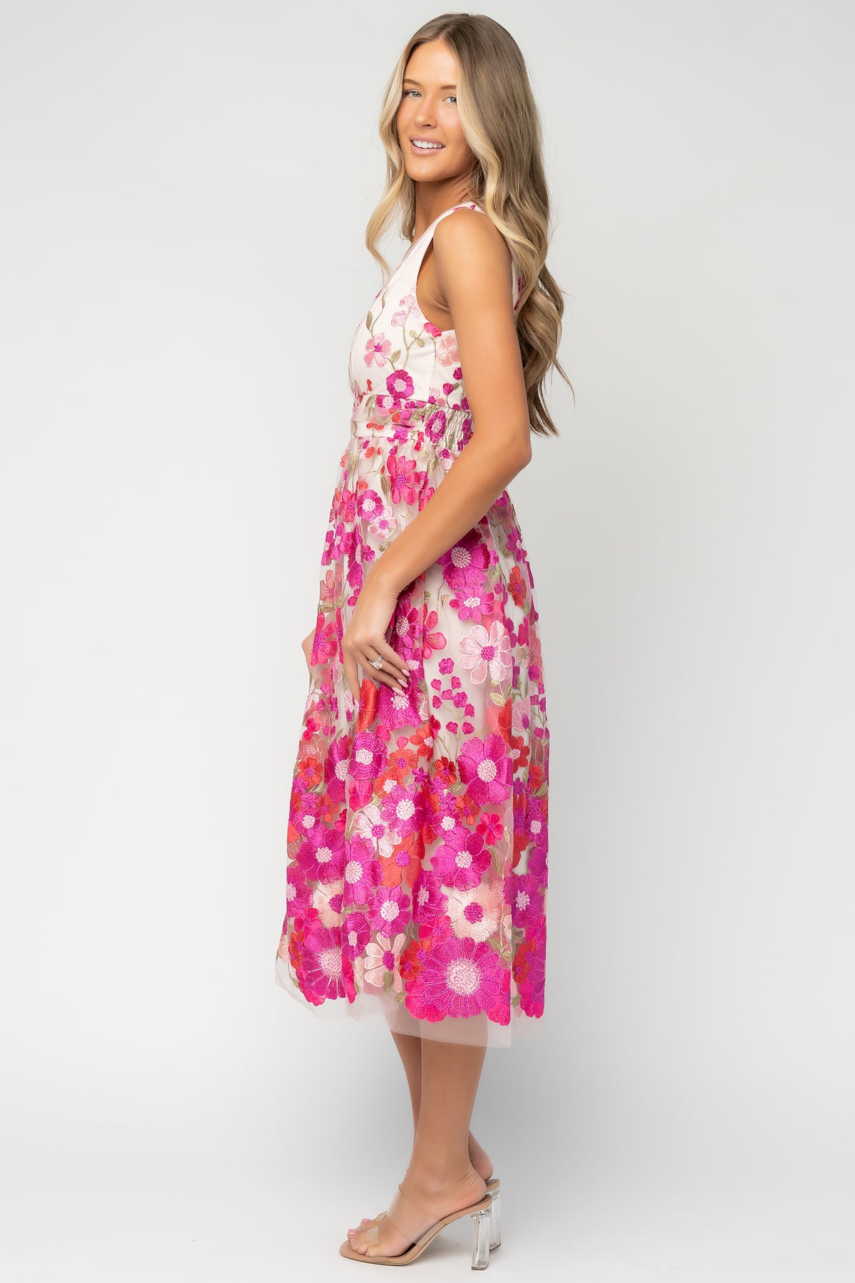 Lila Embroidered Midi Dress in Pink Multi with floral embroidered tulle, V-neckline, pleated bodice, and tiered midi skirt.