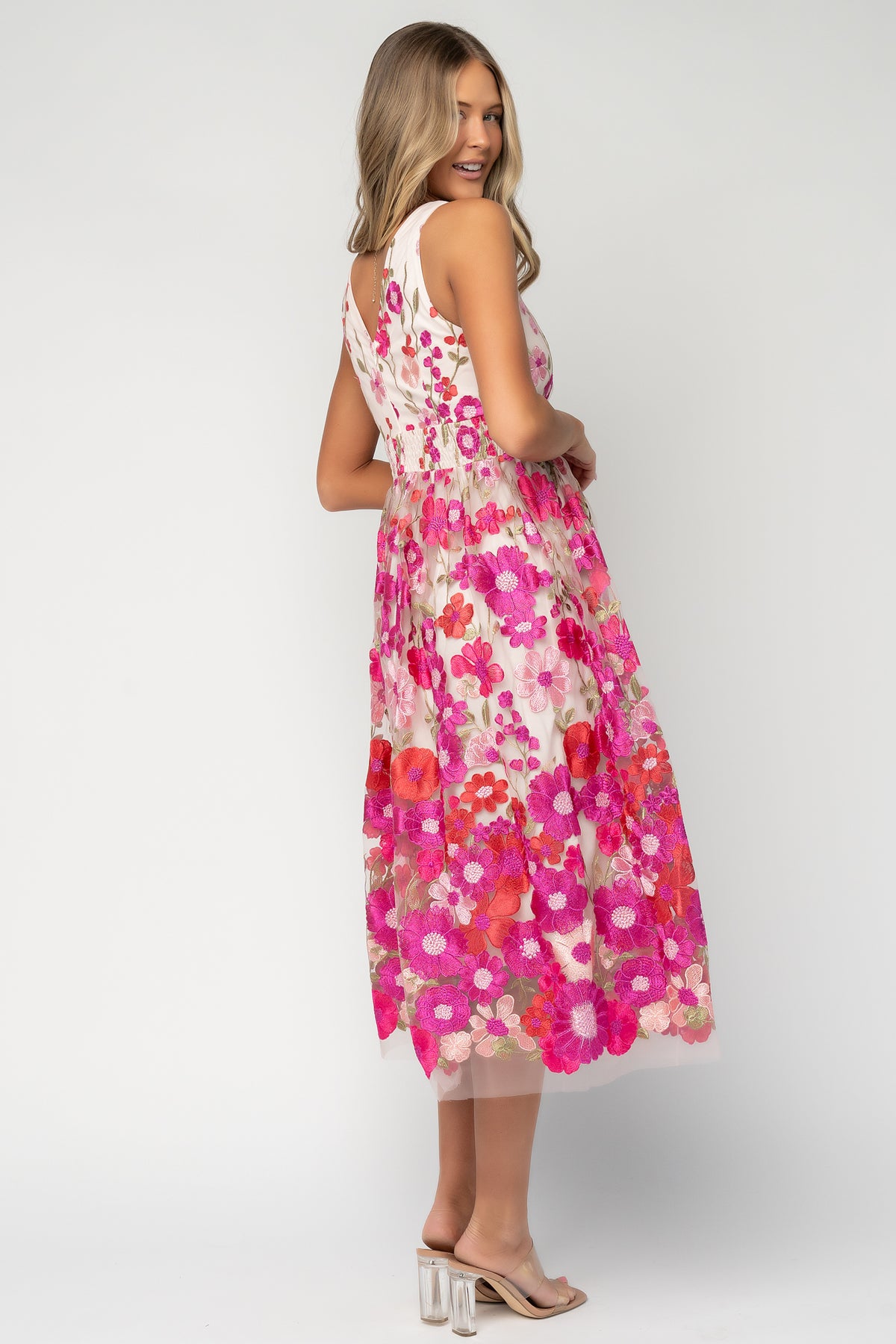 Lila Embroidered Midi Dress in Pink Multi with floral embroidered tulle, V-neckline, pleated bodice, and tiered midi skirt.