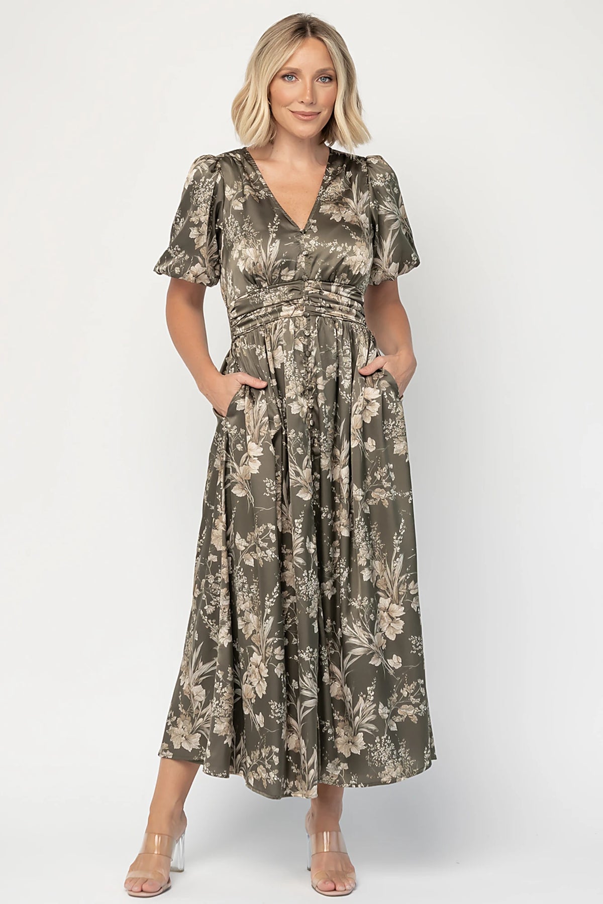 Lilibet Satin Dress in Olive Floral with V-neckline, short sleeves, faux front buttons, gathered waist, and satin finish.