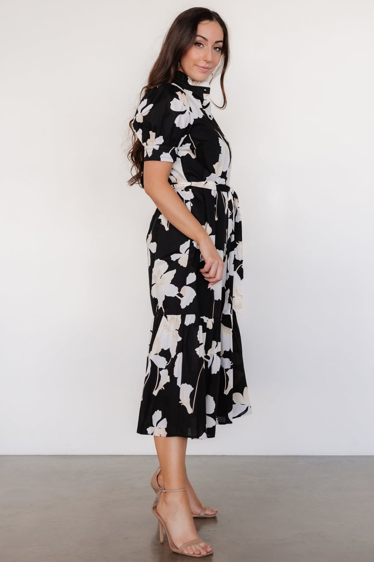 Side view highlighting hidden side pocket, removable self-tie sash at waist, and the tiered skirt silhouette of the cotton dress.