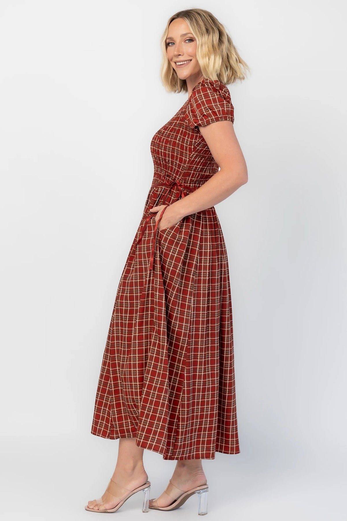 Lorelei Smocked Dress in Red Print with round neckline, smocked bodice, and elastic sleeves.